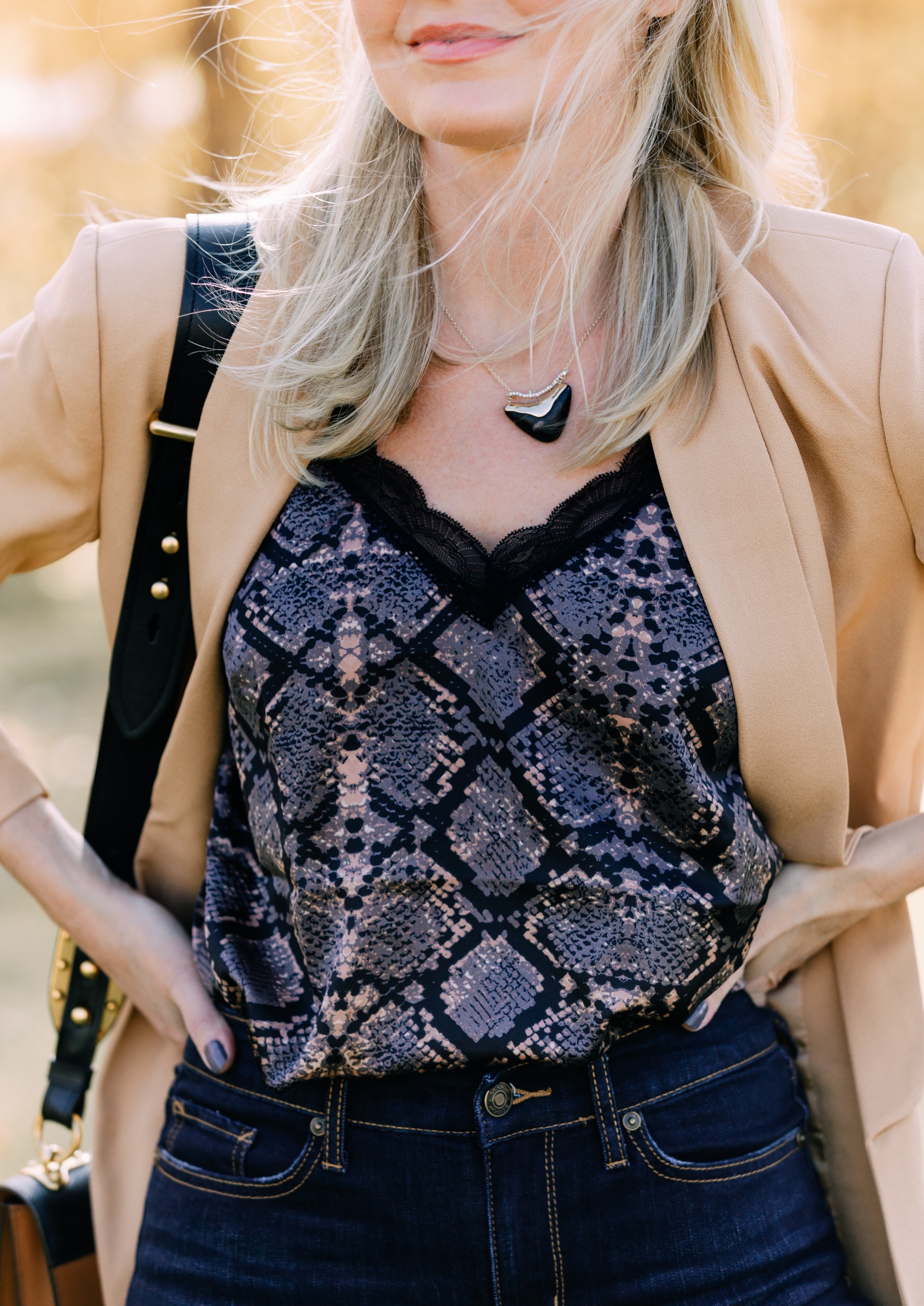 Affordable Fall Fashion, Erin Busbee of Busbee Style wearing dark wash skinny jeans by Scoop, a camel boyfriend blazer by Scoop, a black lacy python print camisole by Scoop, black scrunch stiletto booties by Scoop, Prada Cahier black and brown bag, and Salvatore Ferragamo sunglasses in Telluride, Colorado