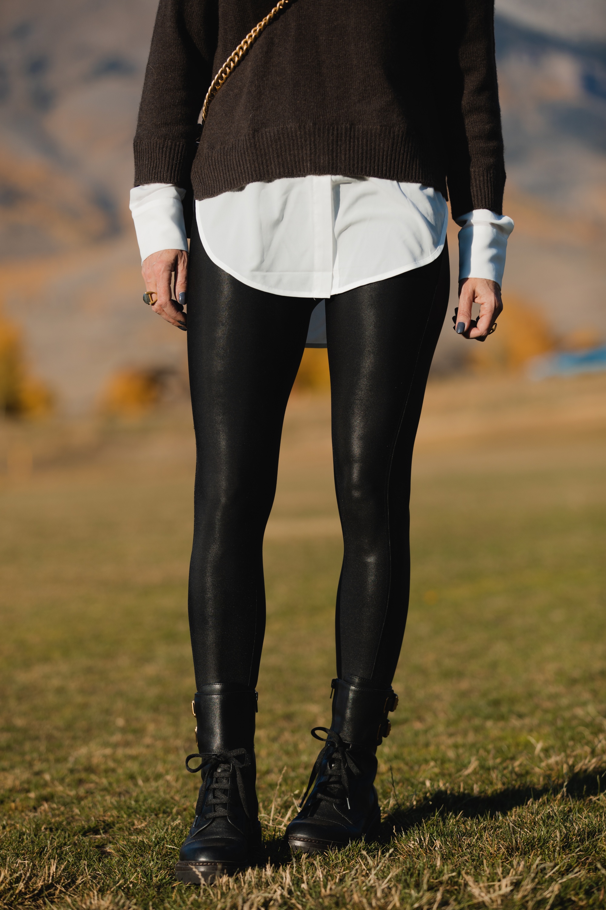 Layered Sweater, Erin Busbee of Busbee Style wearing a brown layered sweater by Brochu Walker, Spanx faux leather leggings, See by Chloe combat boots, and black Chanel boy bag in Telluride, Colorado