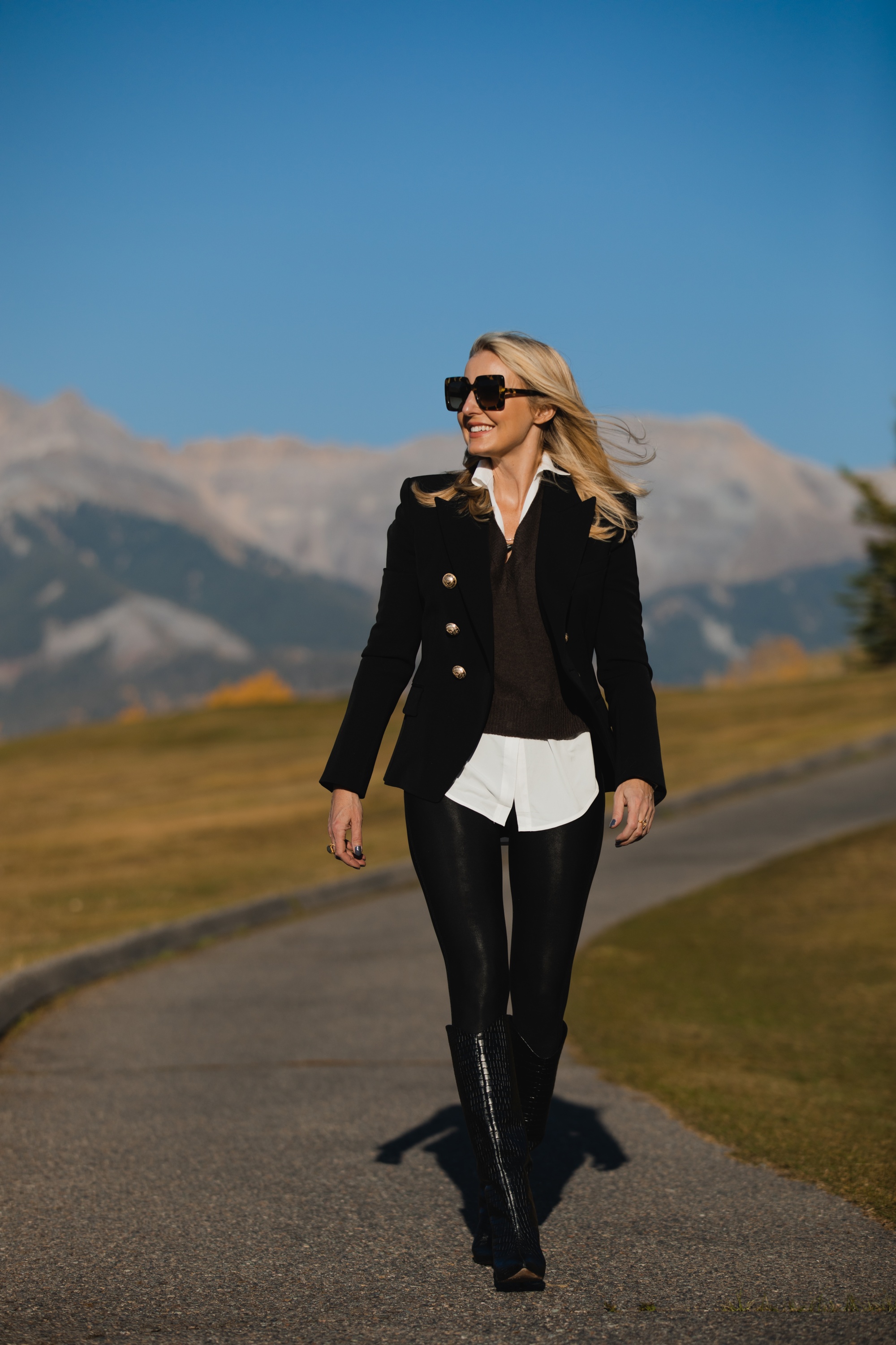 Layered Sweater, Erin Busbee of Busbee Style wearing a brown layered sweater by Brochu Walker, Spanx faux leather leggings, black croc embossed boots by Schutz, and black Balmain blazer in Telluride, Colorado