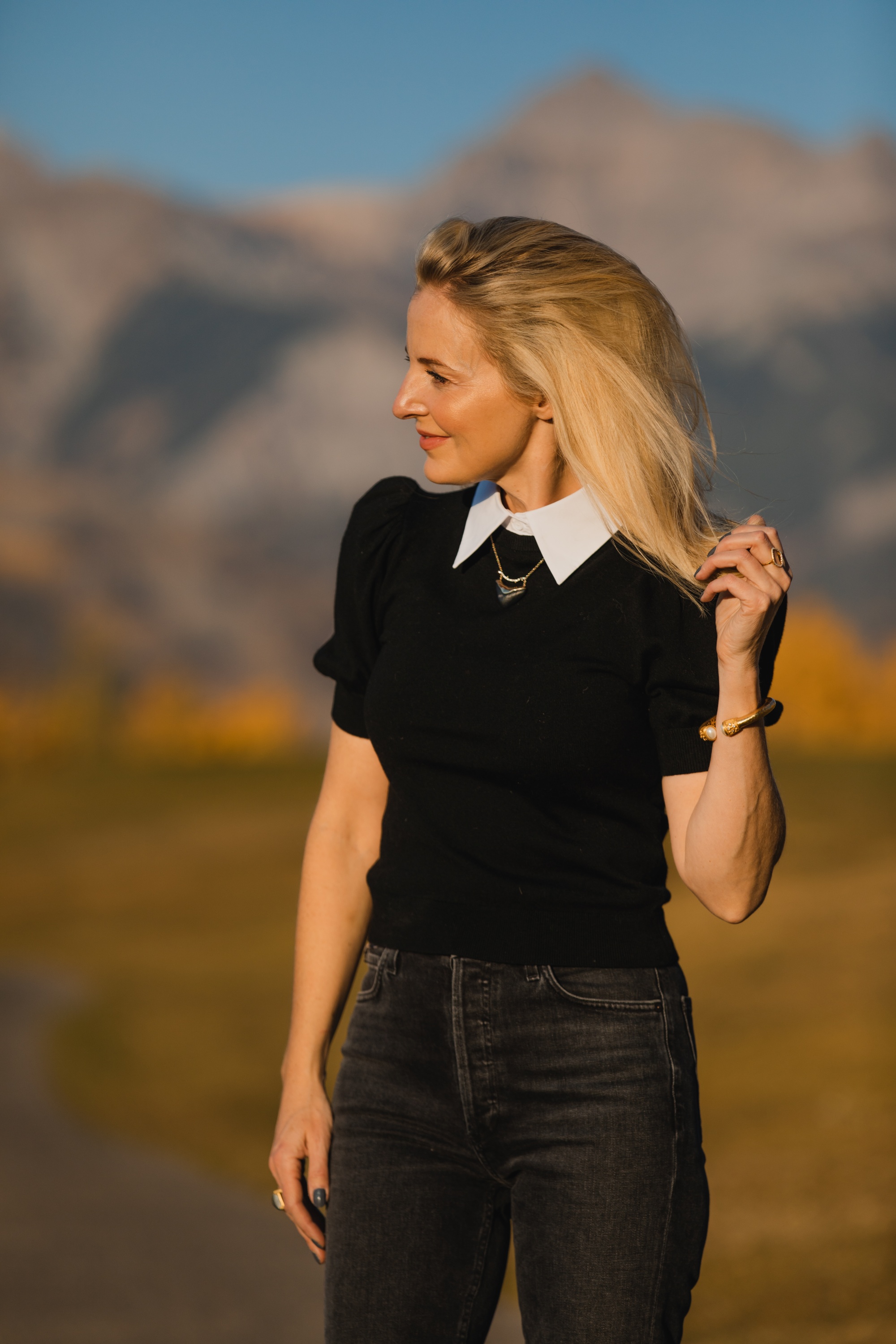 Layered Sweater, Erin Busbee of Busbee Style wearing a black puff shoulder layered sweater by Alice + Olivia with gray wash Agolde Nico jeans in Telluride, Colorado