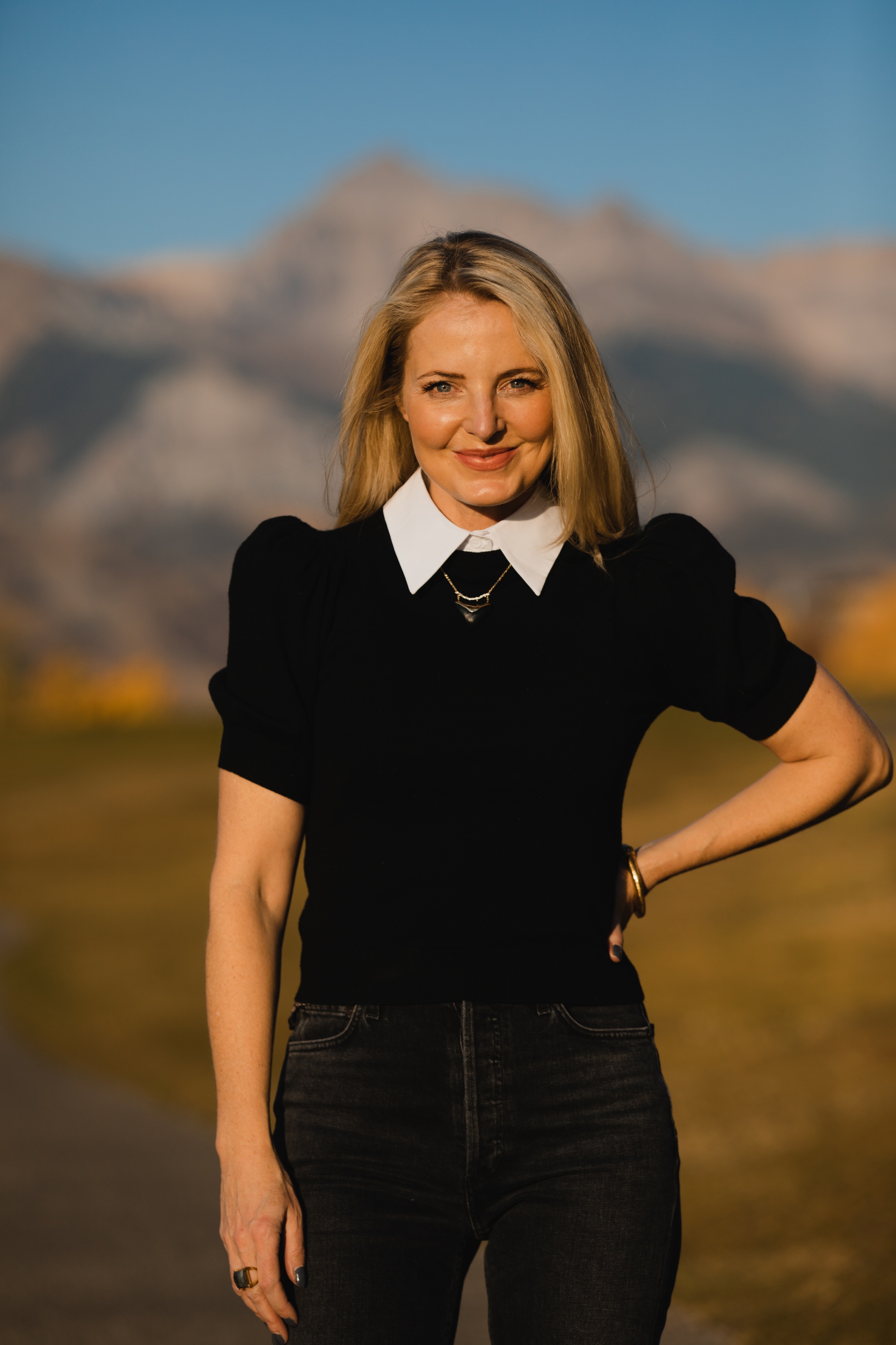 Layered Sweater, Erin Busbee of Busbee Style wearing a black puff shoulder layered sweater by Alice + Olivia with gray wash Agolde Nico jeans in Telluride, Colorado