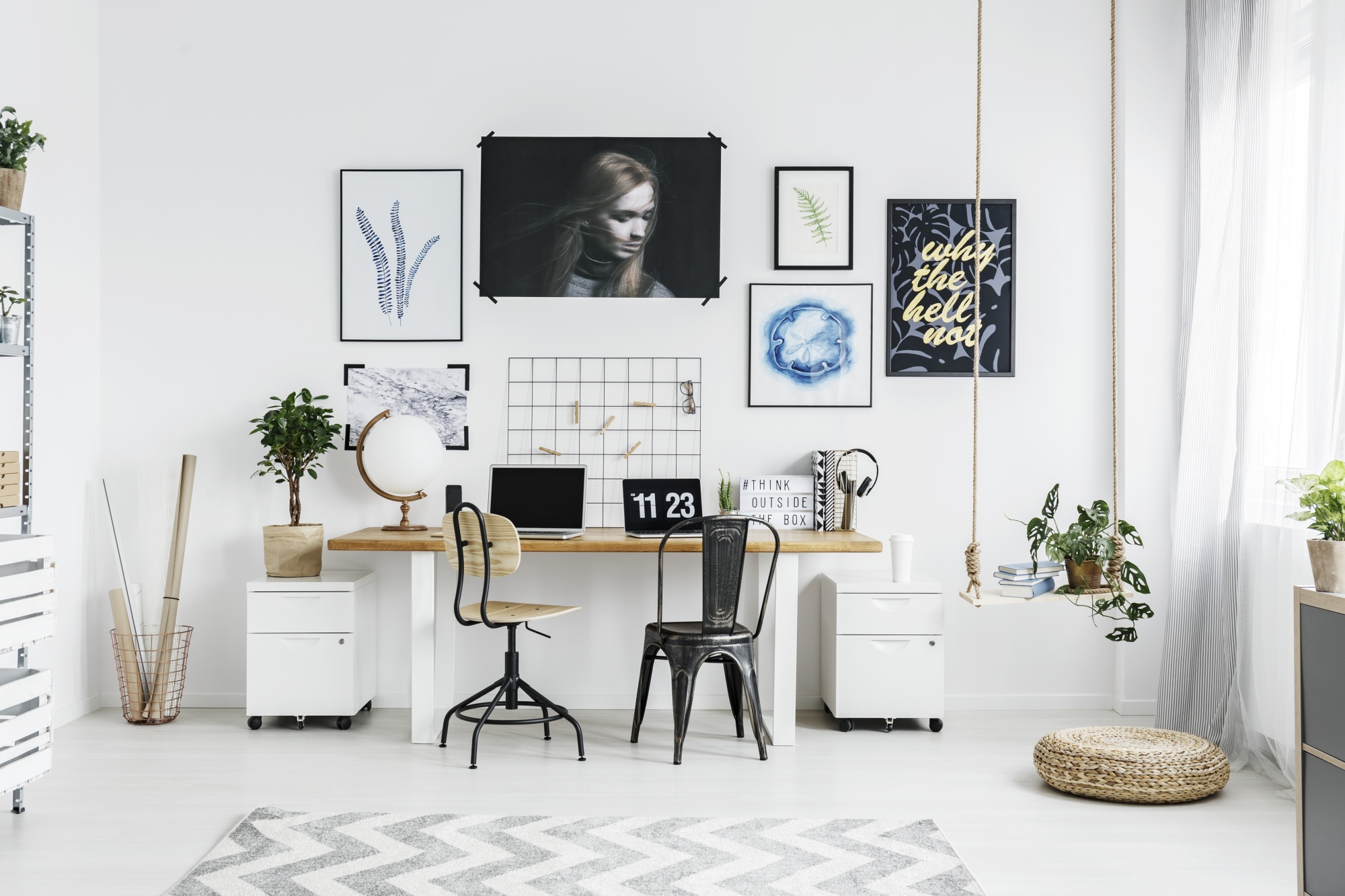 5 Easy Steps To The Perfect and Unique Gallery Wall in an office space with clean lines and neutral tones including a swing used as a planter, posters, art and peg board