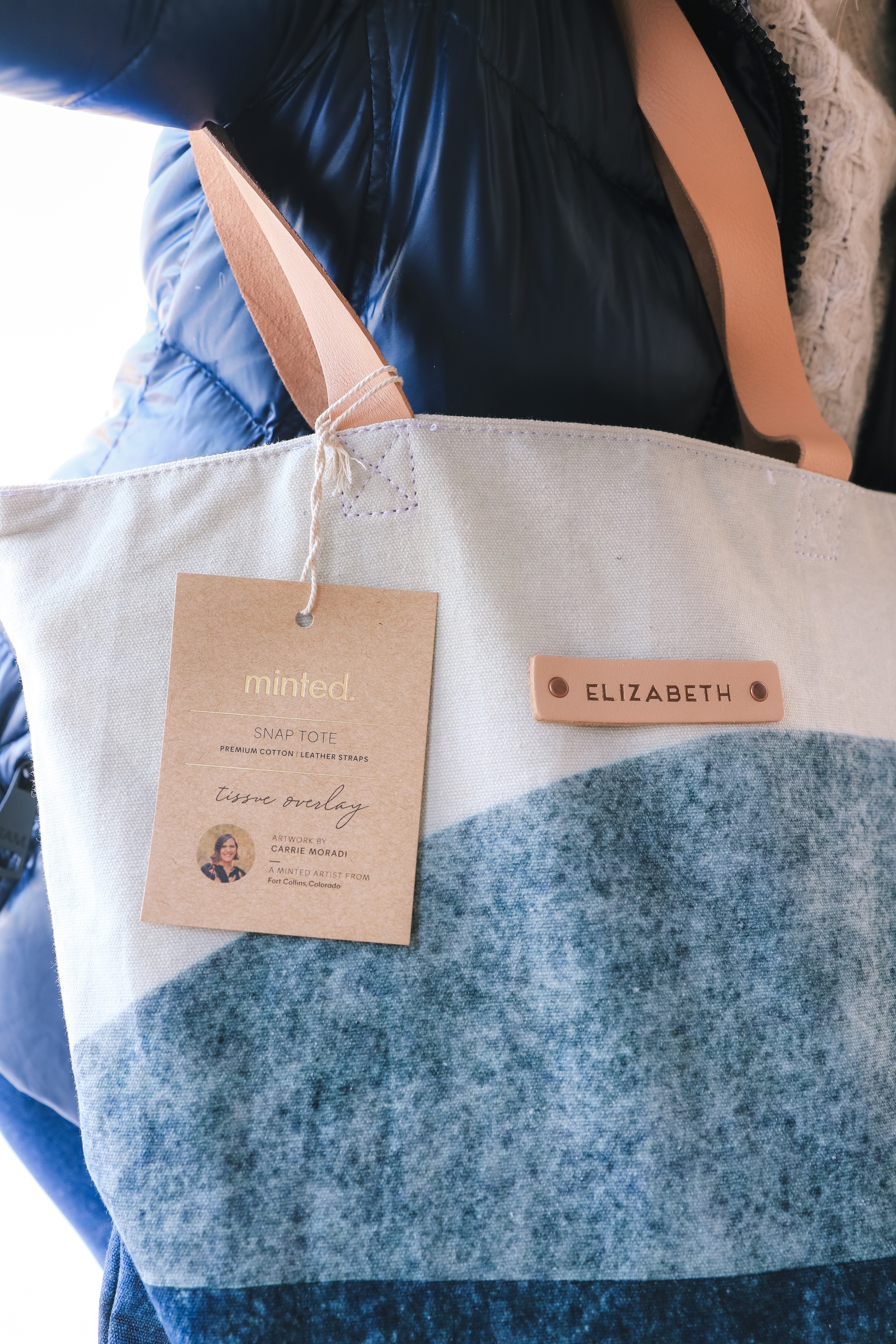 Personalized Gifts, Erin Busbee of Busbee Style sharing a blue and white personalized tote bag with three personalized planners, oven mitts, and aprons from Minted in Telluride, Colorado