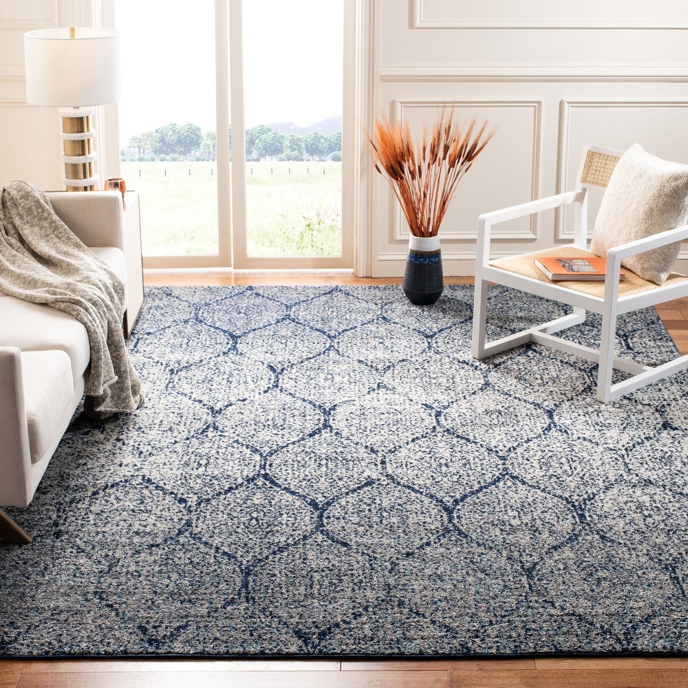 How To Choose The Perfect Rug For Your Space featuring large blue patterned rug for a large room