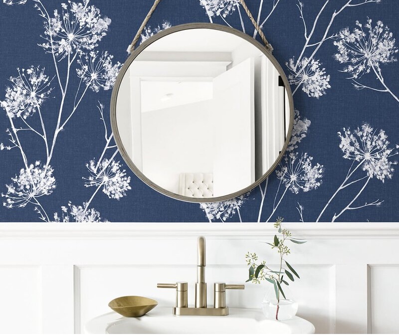 How To Update Your Powder Room With These 4 Easy Changes including peel and stick removeable wallpaper in a floral blue pattern on the vanity wall.
