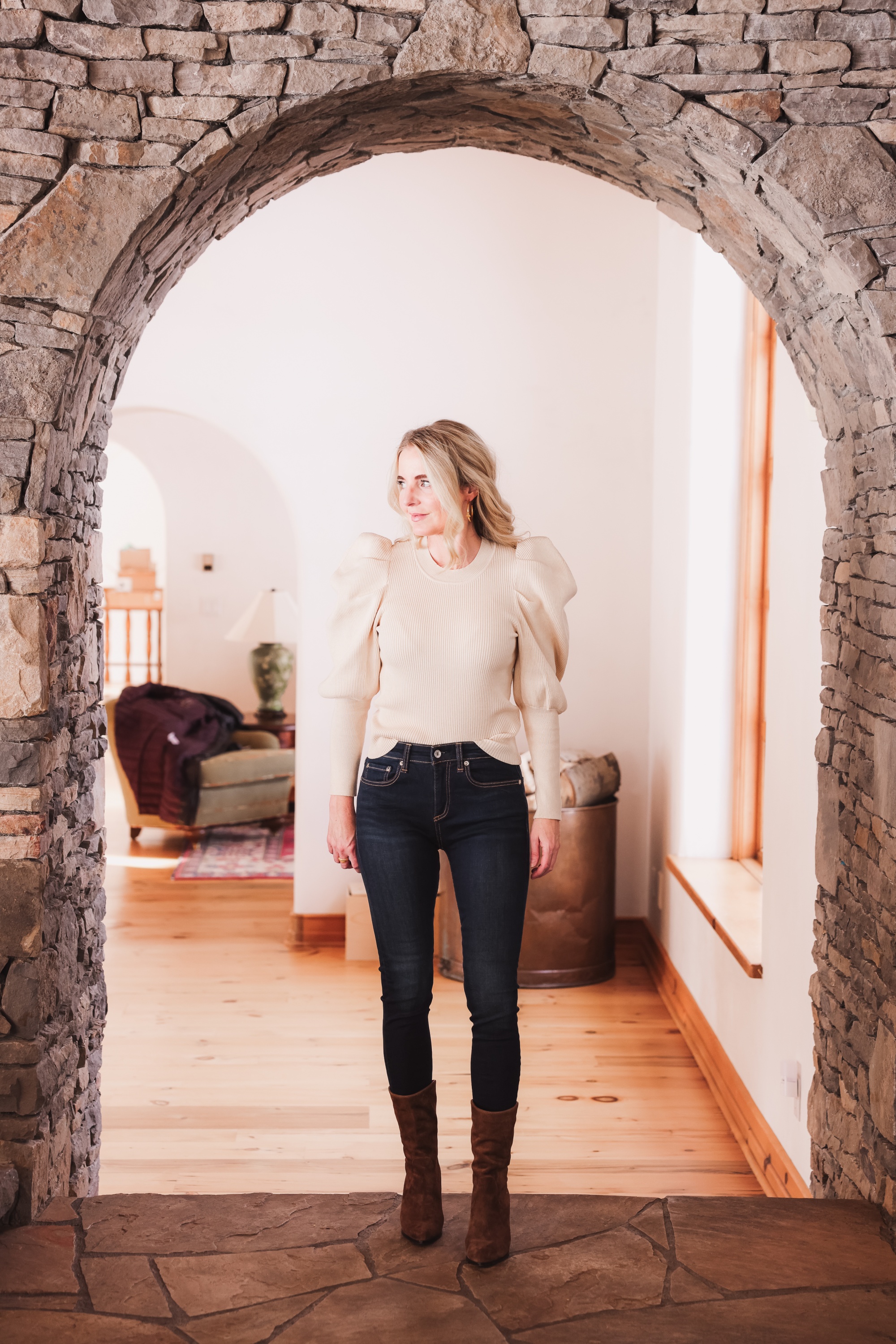 Best brown booties, Erin Busbee of Busbee wearing an ASTR the Label sculptural sleeve sweater with rag & bone skinny jeans and brown western inspired Paige booties from Nordstrom in Telluride, Colorado