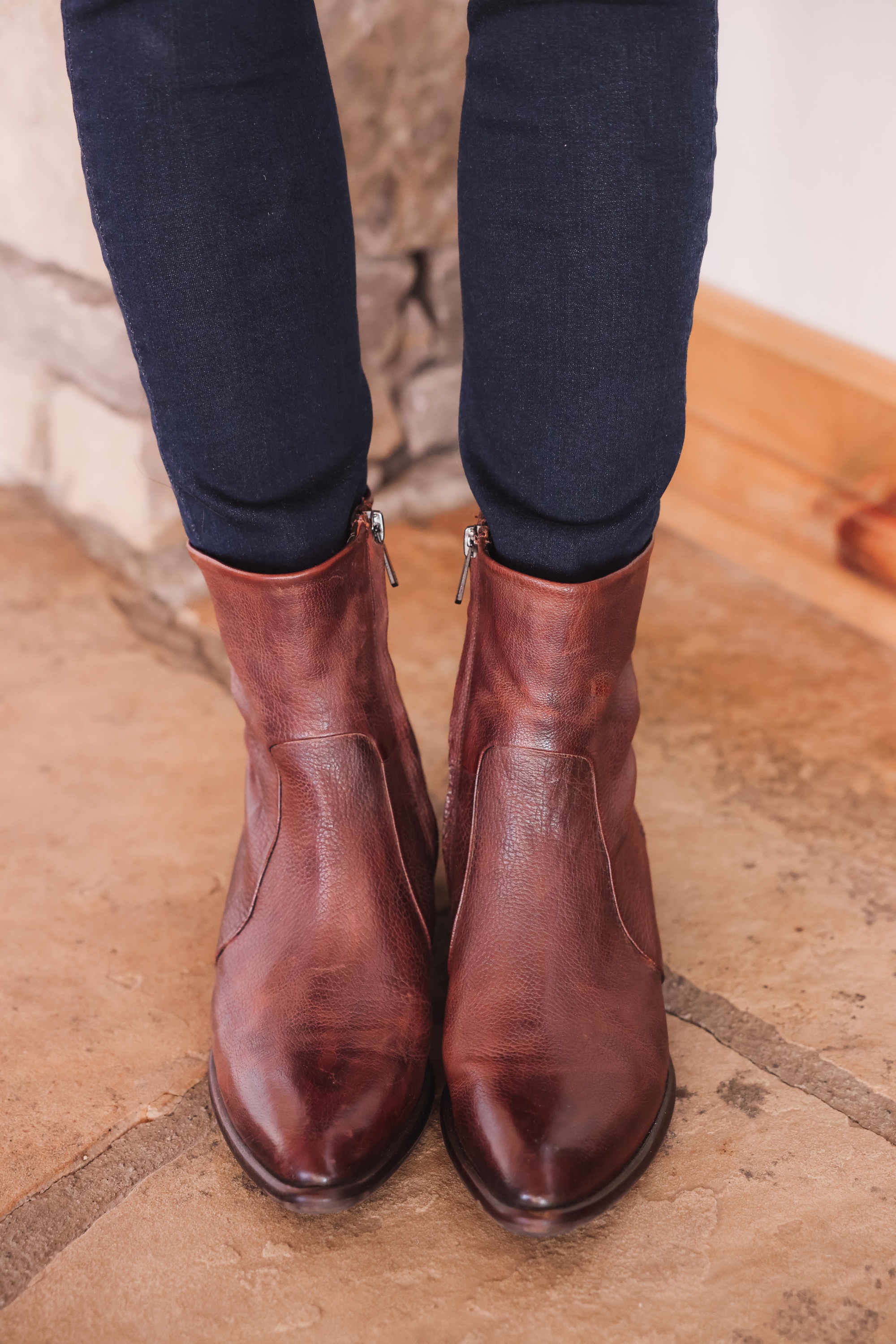 Best brown booties, Erin Busbee of Busbee wearing an ASTR the Label sculptural sleeve sweater with rag & bone skinny jeans and brown sam edelman hilary booties from Nordstrom in Telluride, Colorado