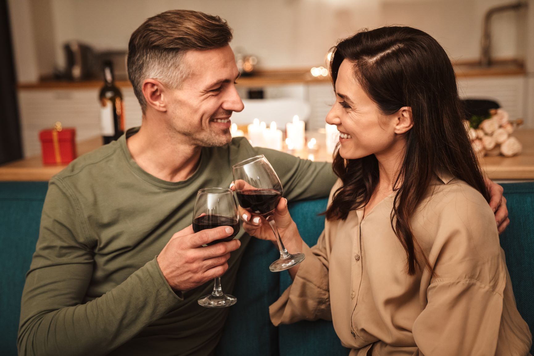 better sex after menopause Middle aged couple toasting with red wine