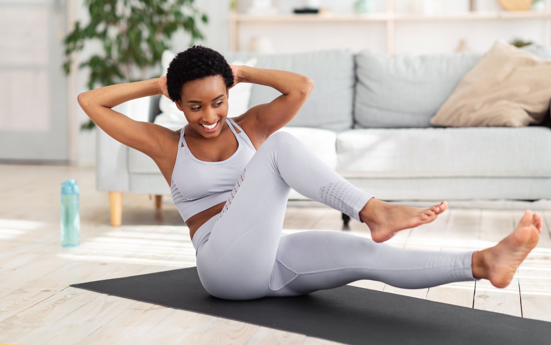 get rid of mummy tummy for good, Short-haired Black woman core strength