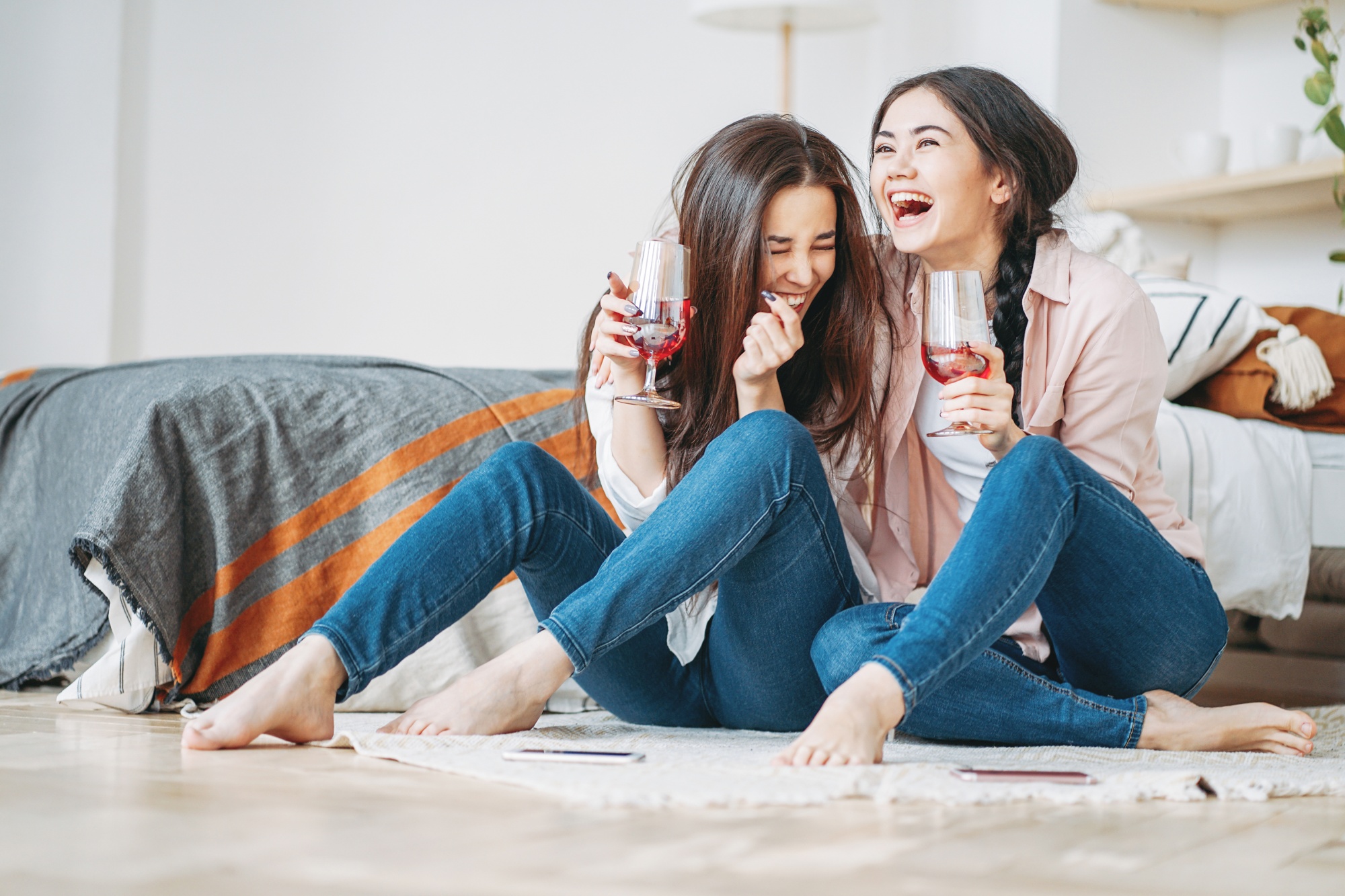 life with a teenage girl, two teen girlfriends having fun, laughing, drinking wine