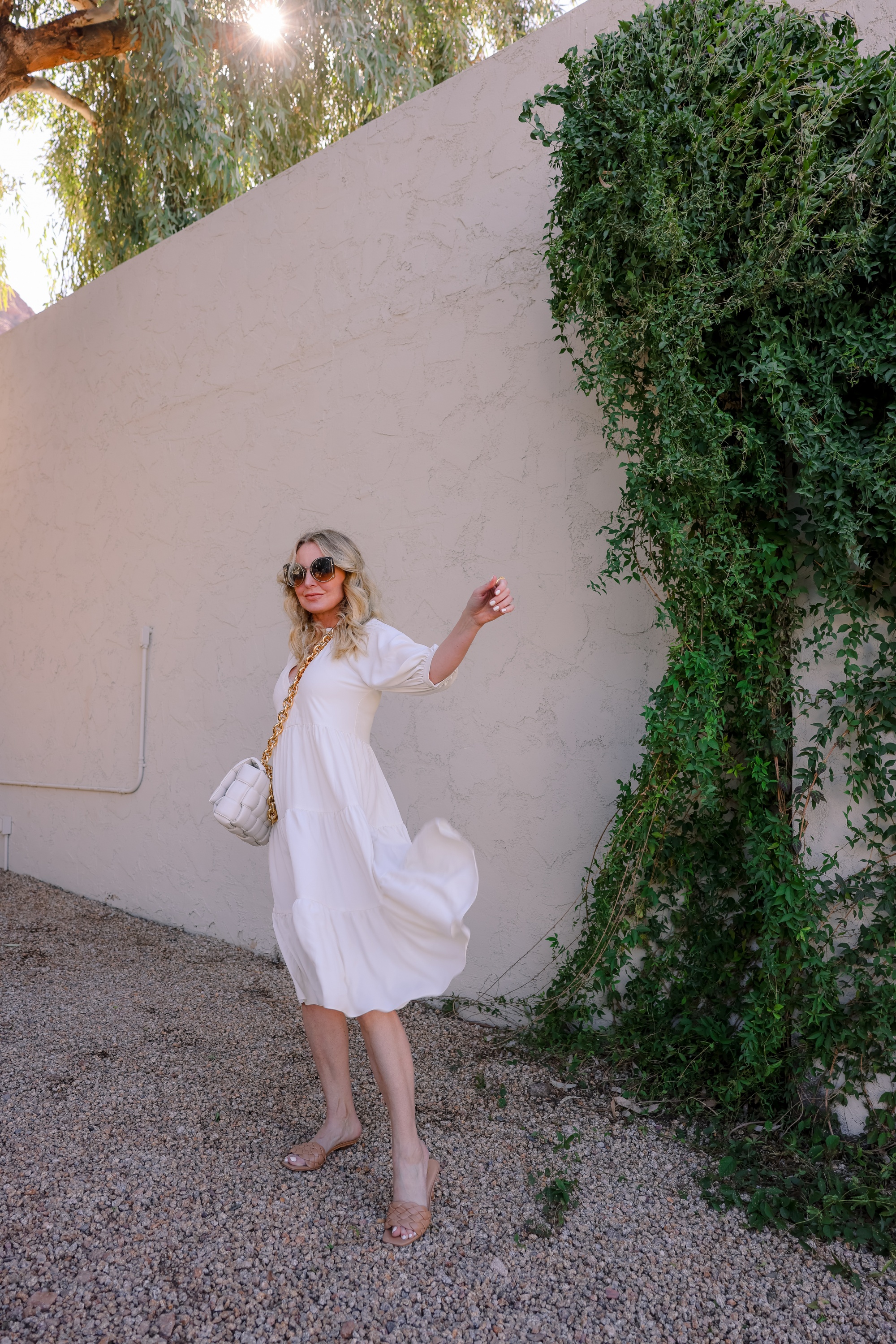 White dresses for spring! Featuring a beautiful white midi length white dress by Amanda Uprichard on fashion over 40 blogger Erin Busbee