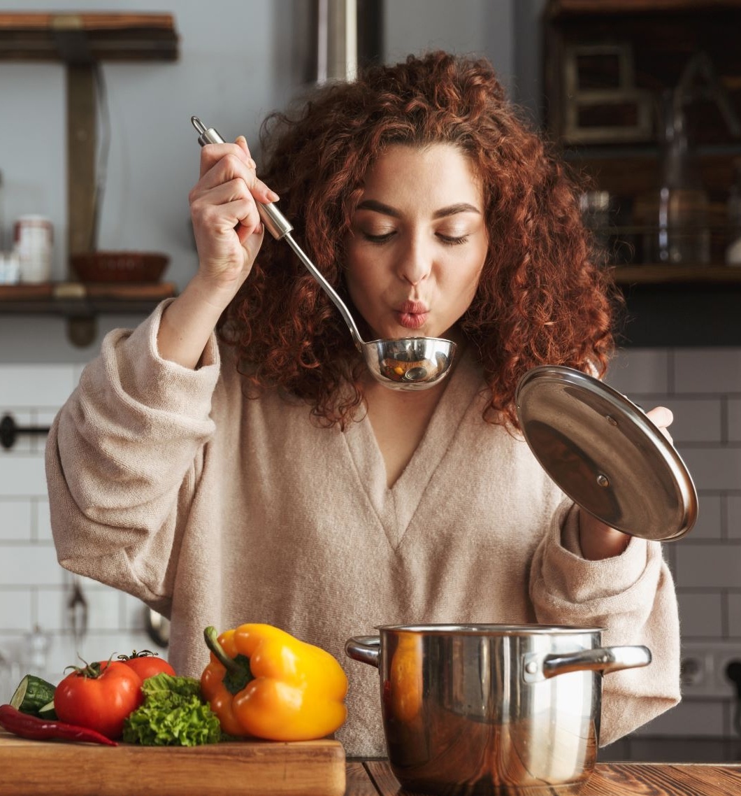 Supercharge your metabolism woman making making soup with ladle in hand