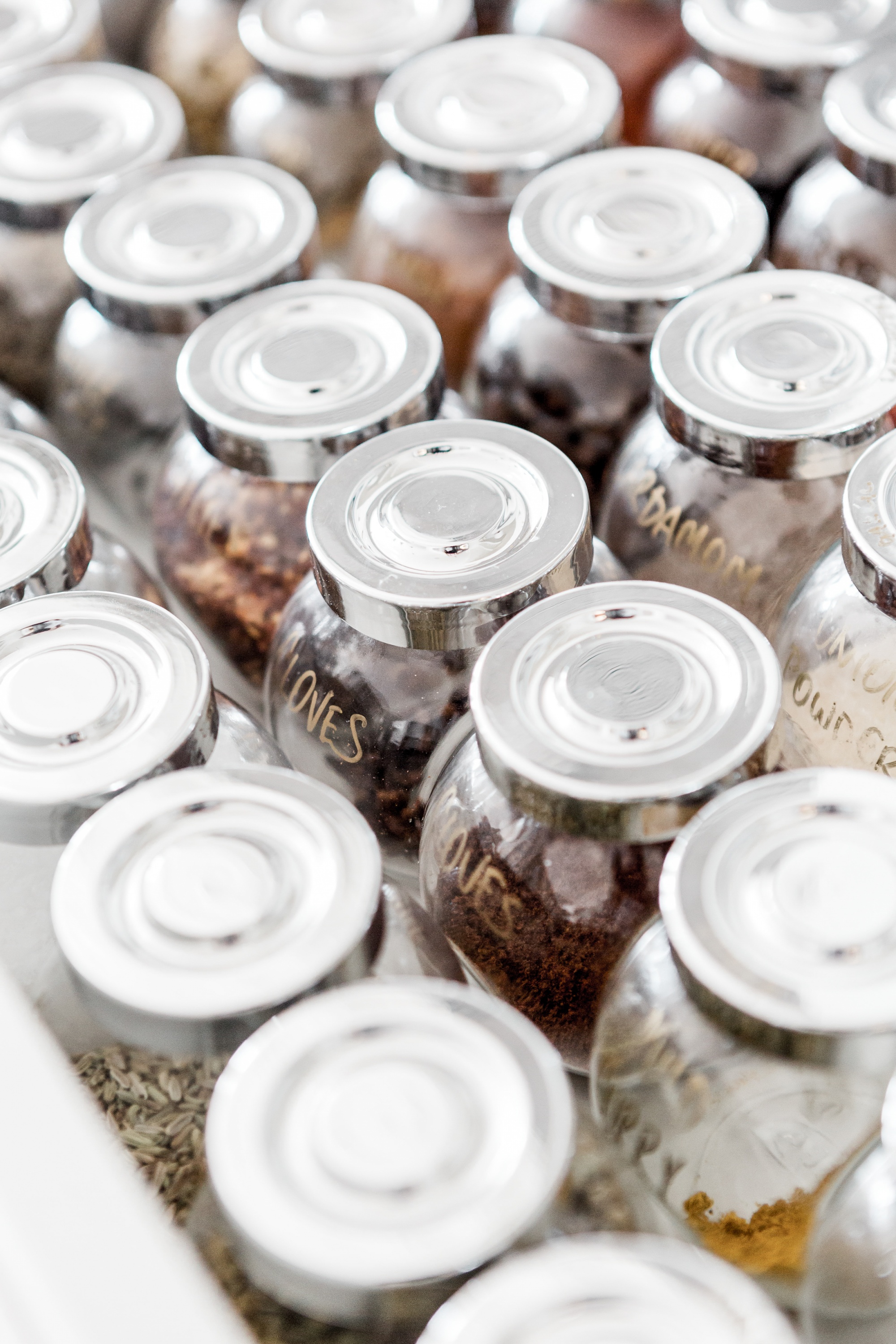 Supercharge your metabolism Glass spice jars with silver lids in white drawer, best spices for metabolism 