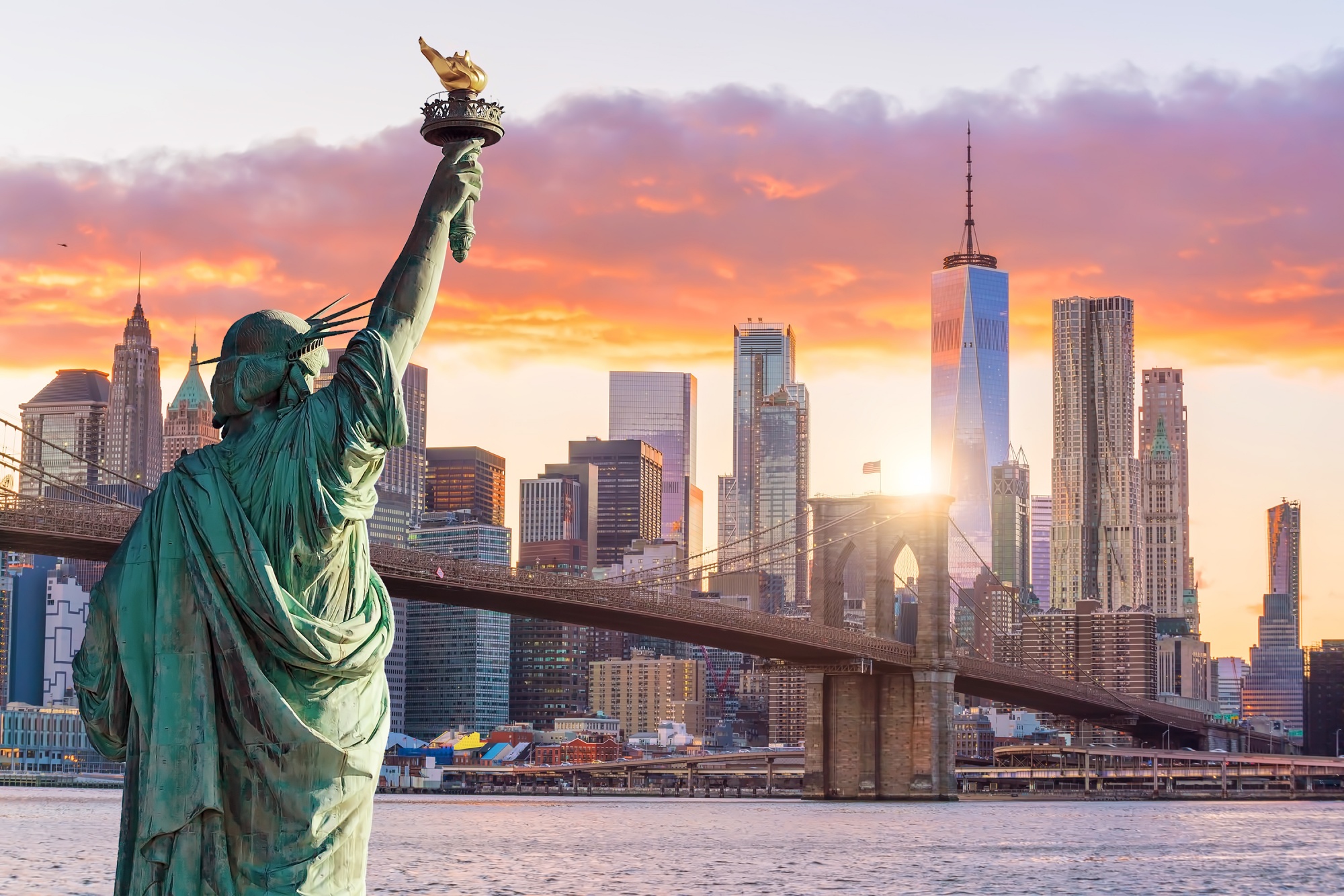 travel destinations for foodies, Statue Liberty and New York City skyline at sunset