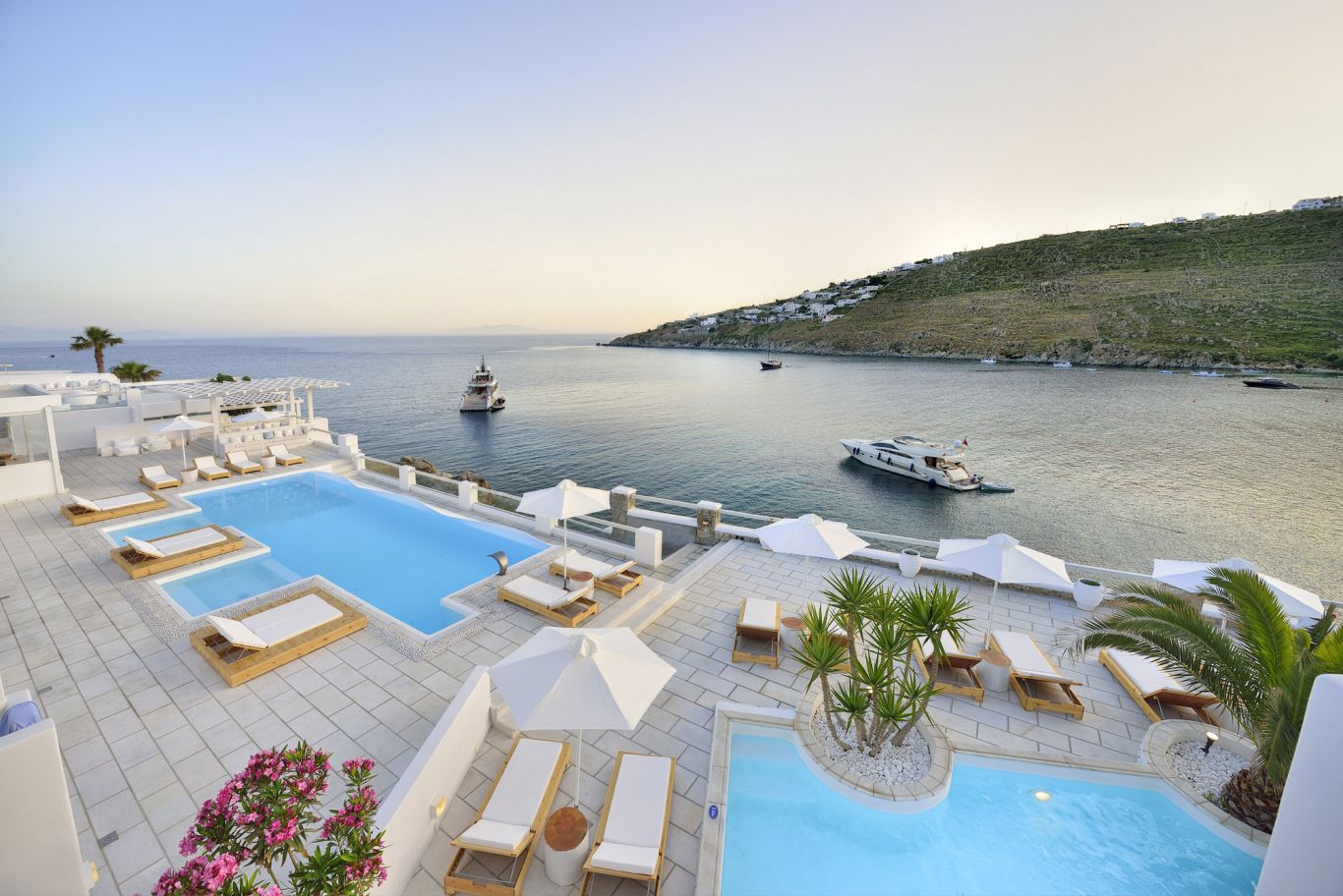 international girls getaways, the deck and pool at Nissaki Boutique Hotel in Mykonos, Greece, girl time, best International travel destinations, summer travel 