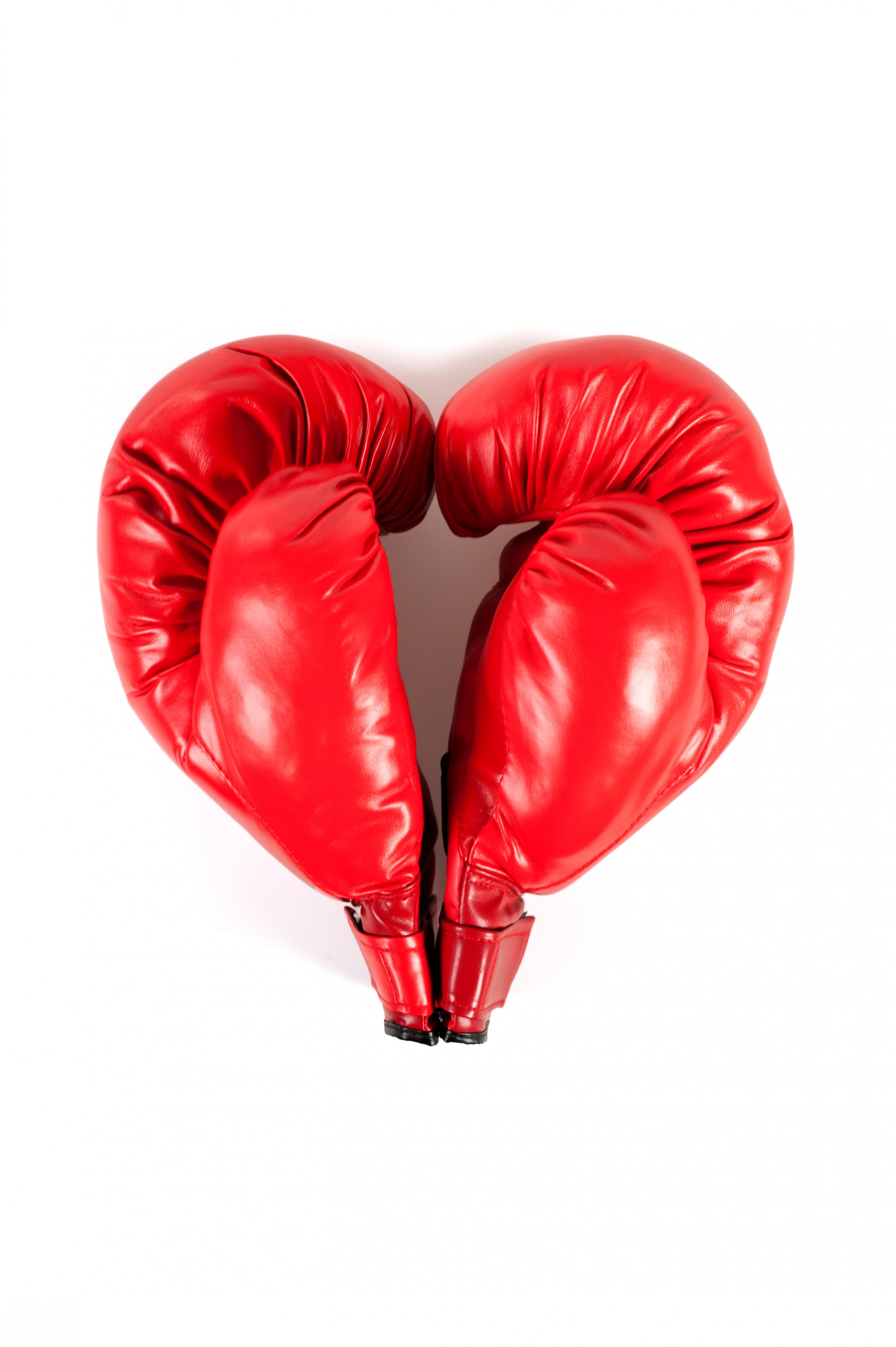 fighting fairly in your relationship, bright red boxing gloves shaped like a heart, love