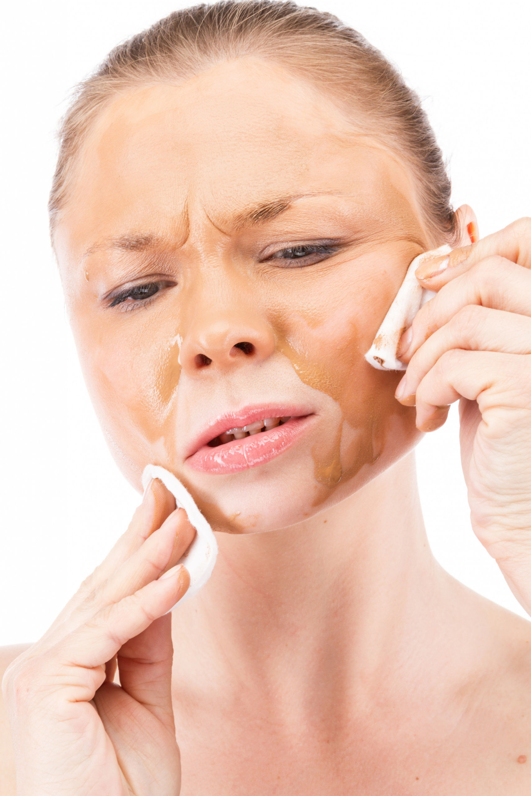 woman scrubbing her face worst things you can do to your skin