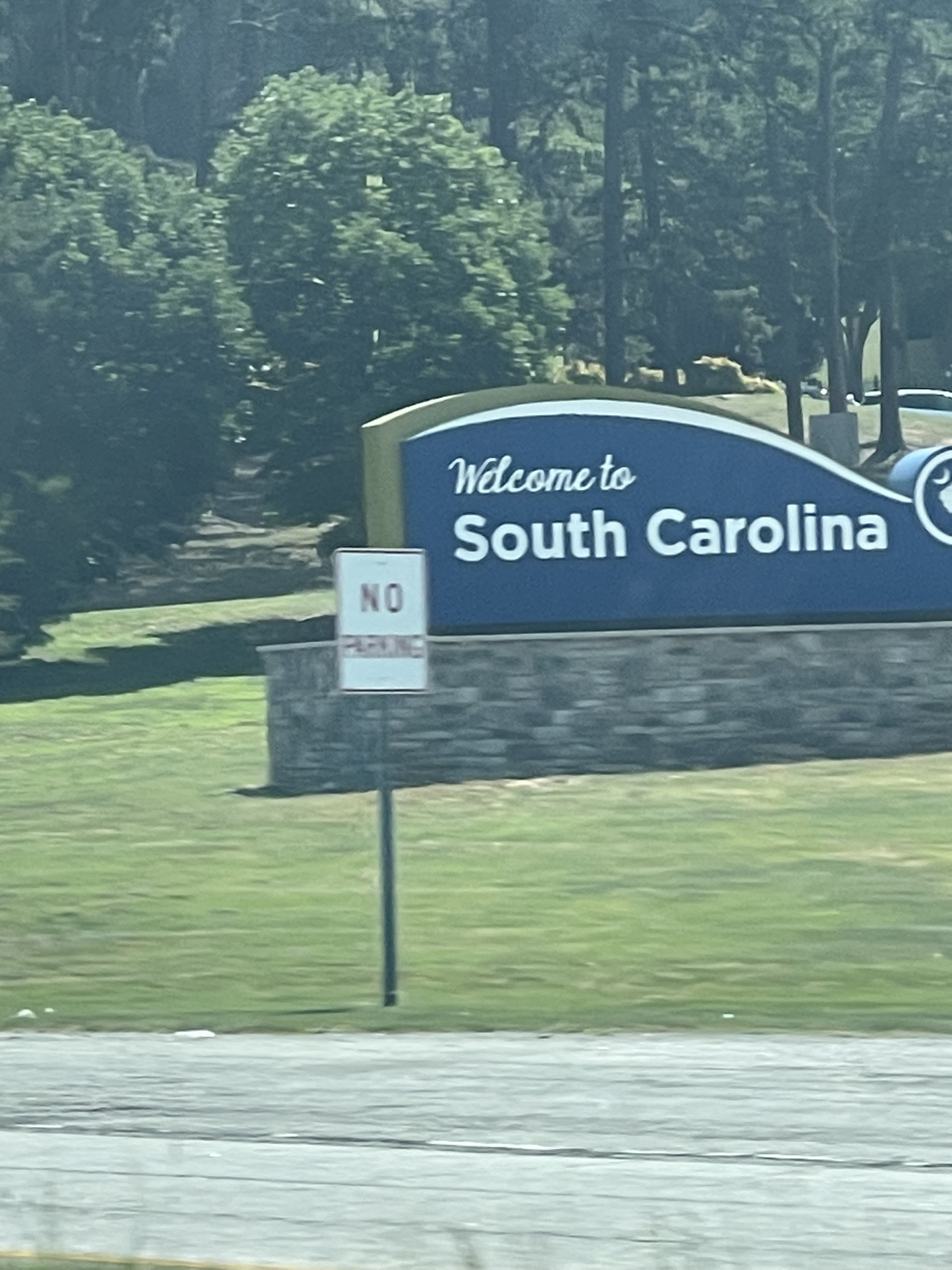 where to stop on a cross-country road trip, best places to stop on a cross country road trip, cross country road trip, west coast to east coast road trip, erin busbee, traveling with kids, how to travel with kids, how to travel with a dog, cross country road trip with kids, south carolina welcome sign