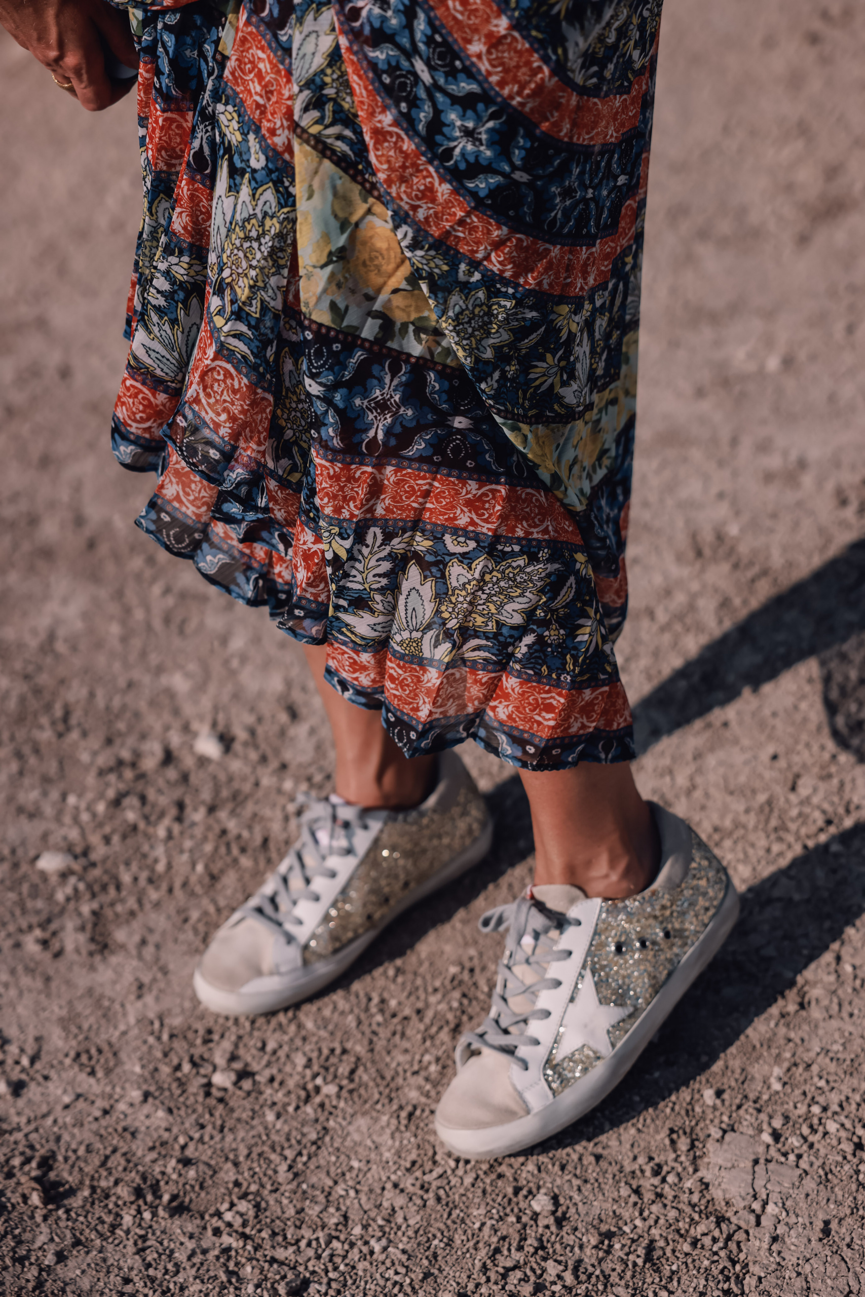 maxi skirts, maxi skirts over 40, printed pleatd maxi skirt, alice + olivia maxi skirt, erin busbee, how to wear maxi skirts, free people wire v-neck bodysuit, gold glitter golden goose sneakers