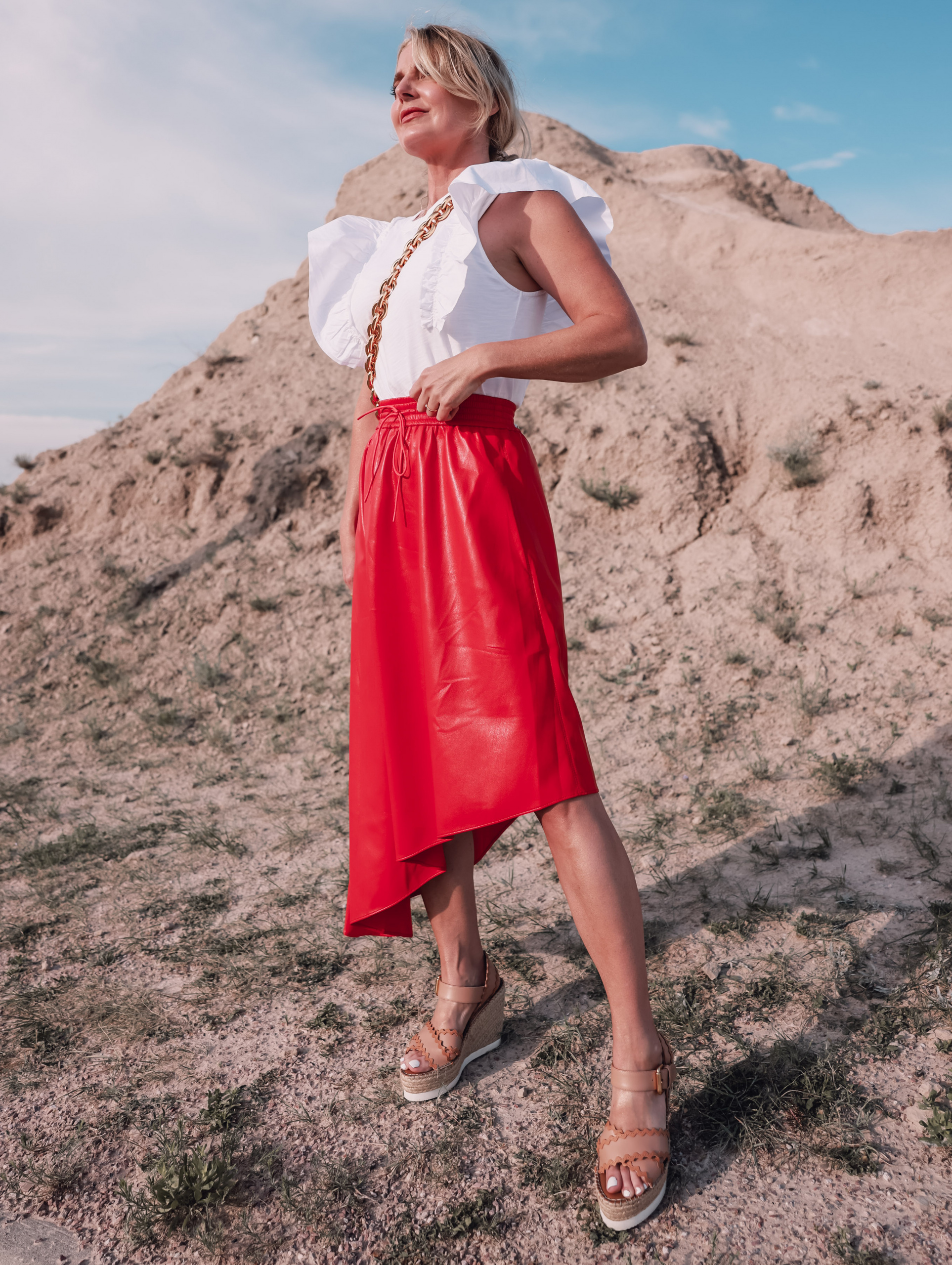 maxi skirts, maxi skirts over 40, printed pleatd maxi skirt, midi skirts over 40, how to wear midi skirts over 40, red alice + olivia midi asymmetrical skirt, erin busbee, how to wear maxi skirts, nation ltd ruffle sleeve tee, see by chloe wedges