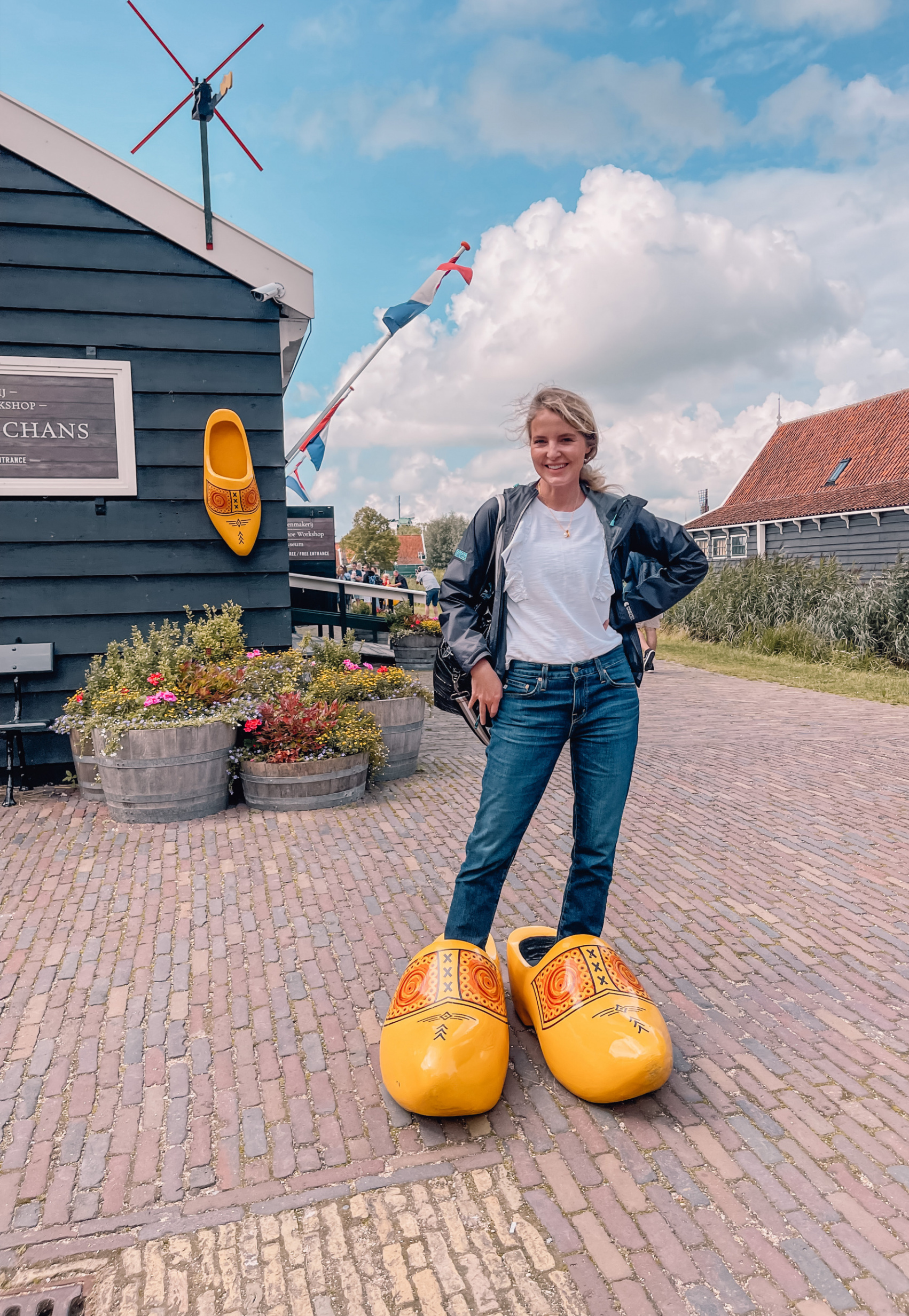 Erin Busbee in Holland standing in wooden clogs,travel to Amsterdam