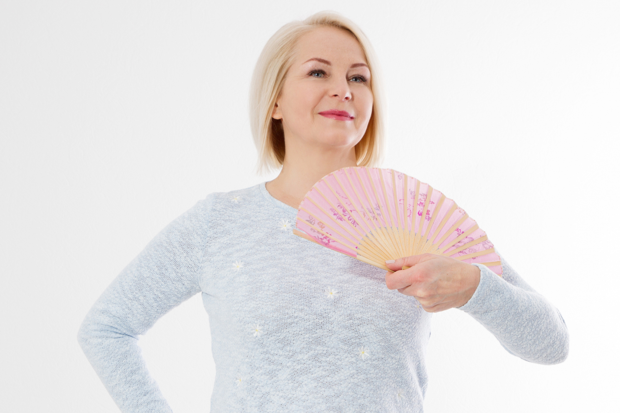 Makeup for Hot Flashes, happy middle aged woman with menopause holding a fan