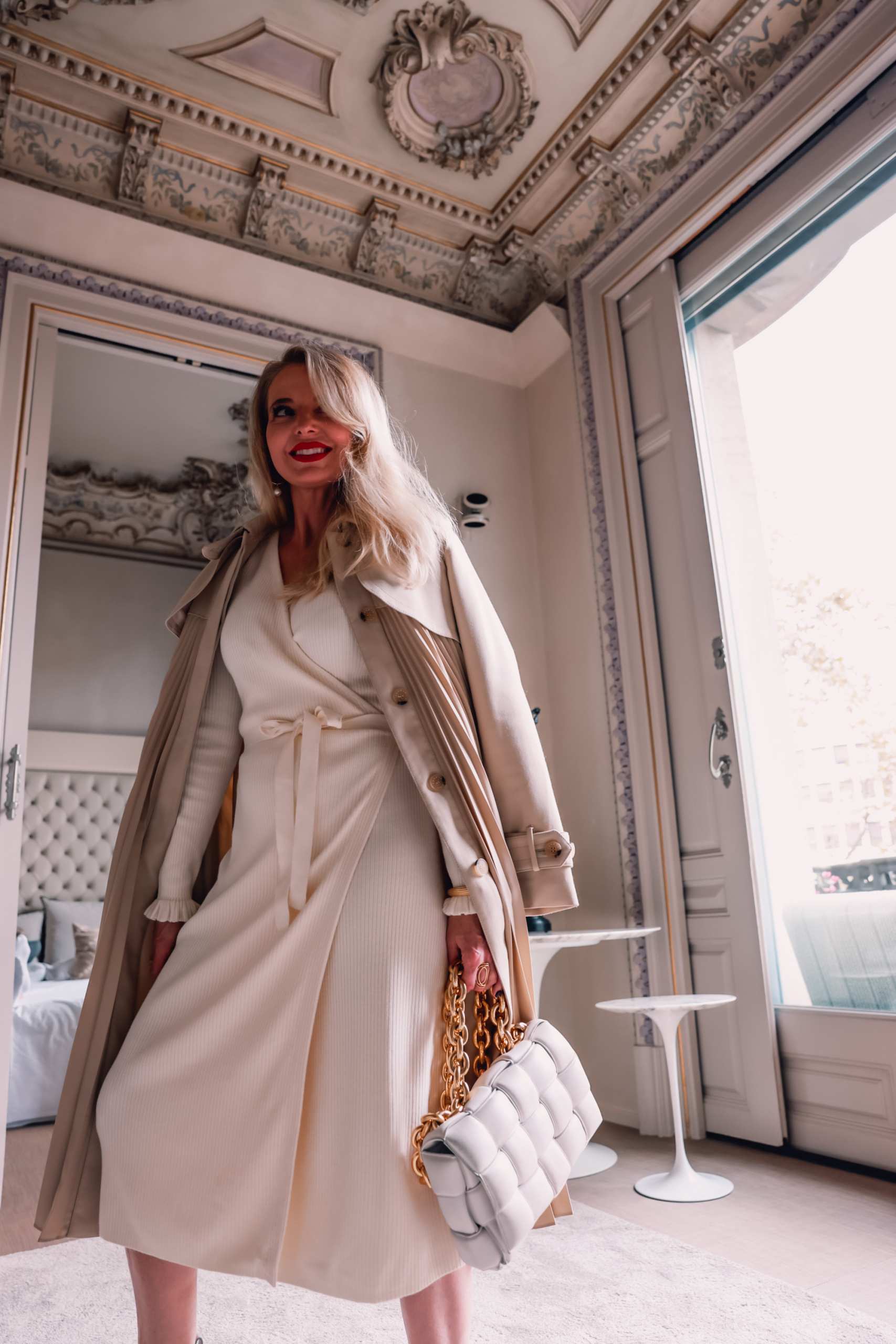 winter neutrals, winter white outfits, winter outfits, neutral outfits, neutral looks, ribbed wrap dress, other stories ribbed wrap midi dress, steve madden wedge chelsea boots, sndro pleated trench coat, erin busbee, el palauet, barcelona, spain