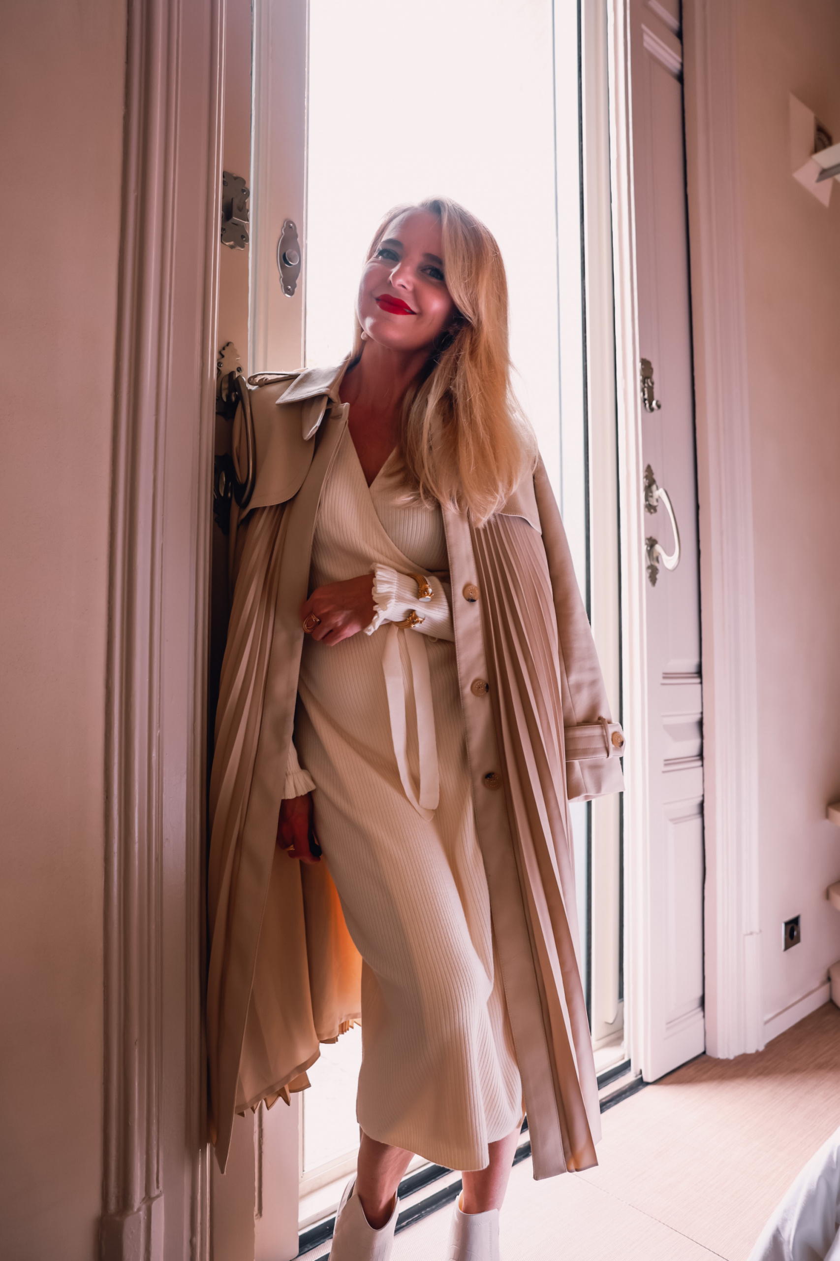 winter neutrals, winter white outfits, winter outfits, neutral outfits, neutral looks, ribbed wrap dress, white winter dress, other stories ribbed wrap midi dress, steve madden wedge chelsea boots, sandro pleated trench coat, erin busbee, el palauet, barcelona, spain
