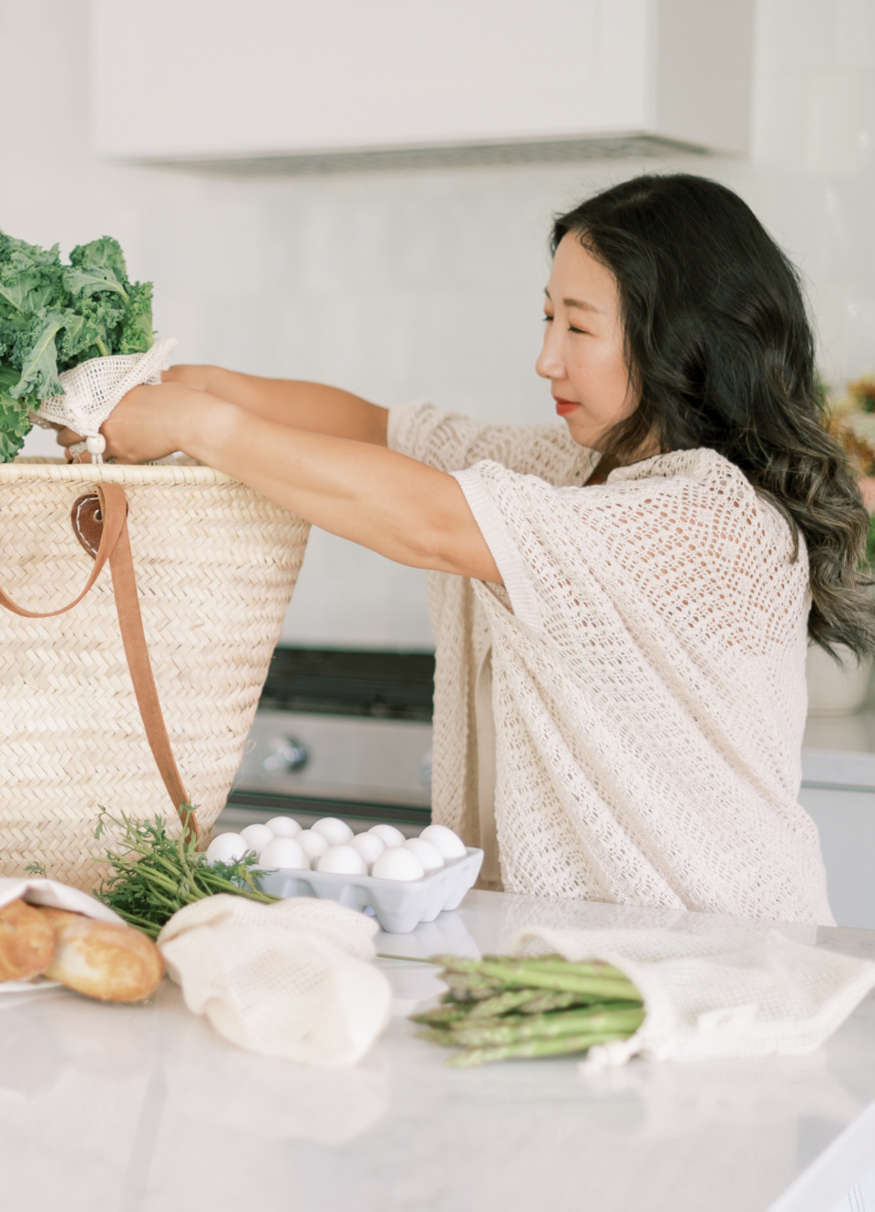 Nutrition Round Up: 12 Apps To Help You, Best Nutrition Apps, Asian woman unloading healthy groceries, keep track of calories, track healthy eating, track eating habits