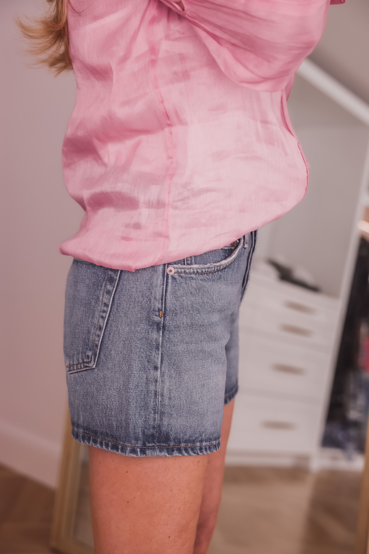 age appropriate denim shorts, denim shorts over 40, how to wear shorts over 40, erin busbee, busbee style, fashion over 40, agolde parker long vintage shorts in occurrence, , see by chloe wedges, pink aje blouse