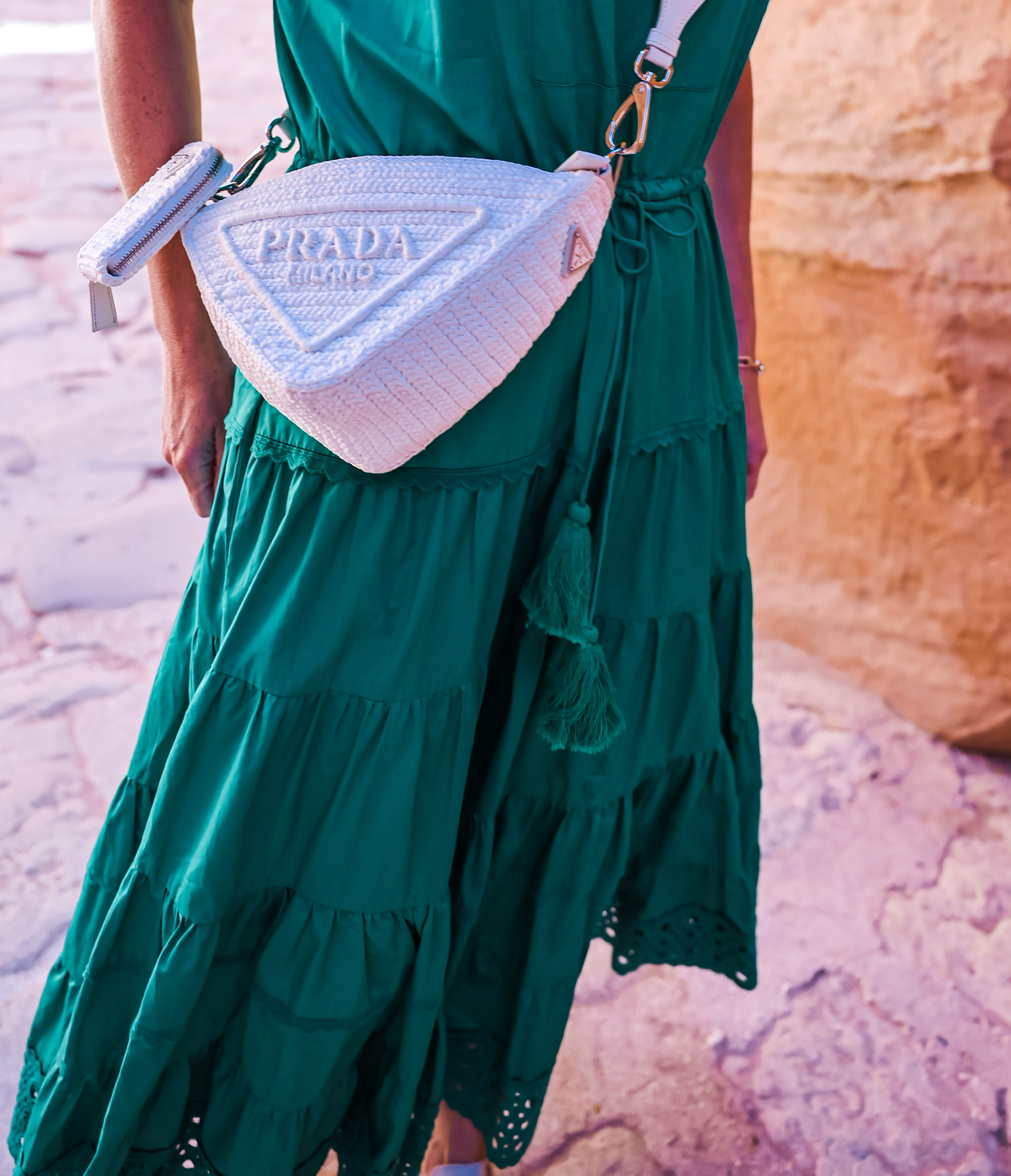 What I wore in Petra Jordan, featuring a green cotton Alexis midi dress, pink cashmere sweater, chloe sneakers