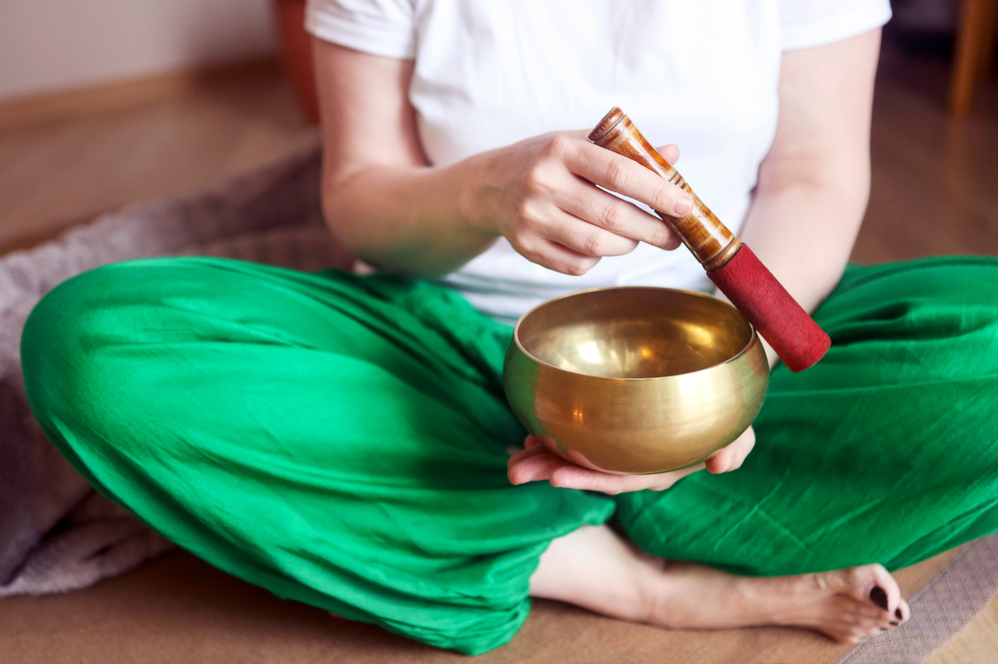 habits to improve wellbeing, woman using Tibetan Singing Bowl, sound therapy, self care, self care routine, how to find time for self care