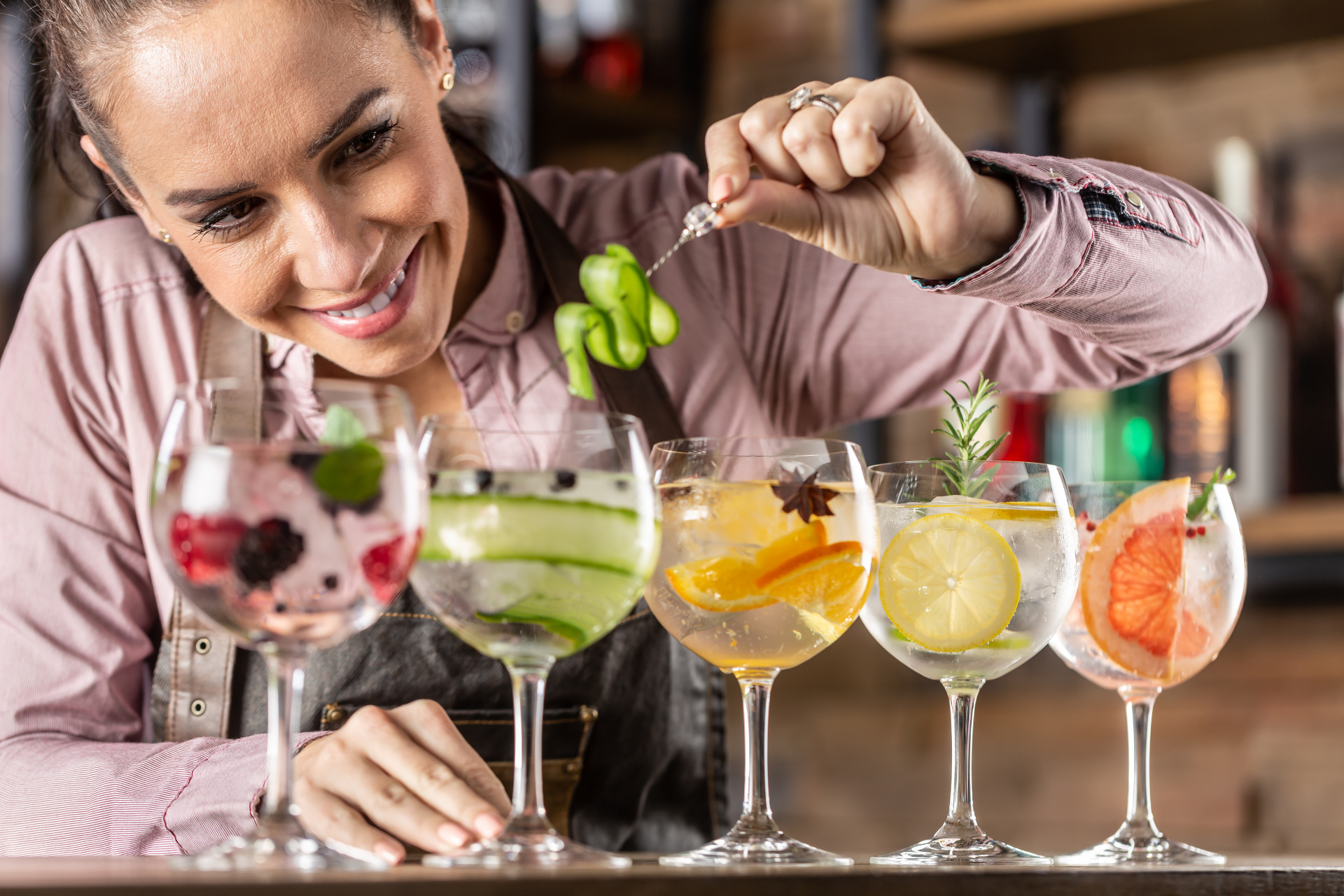 low-sugar drinks, woman makes a row of pretty drinks
