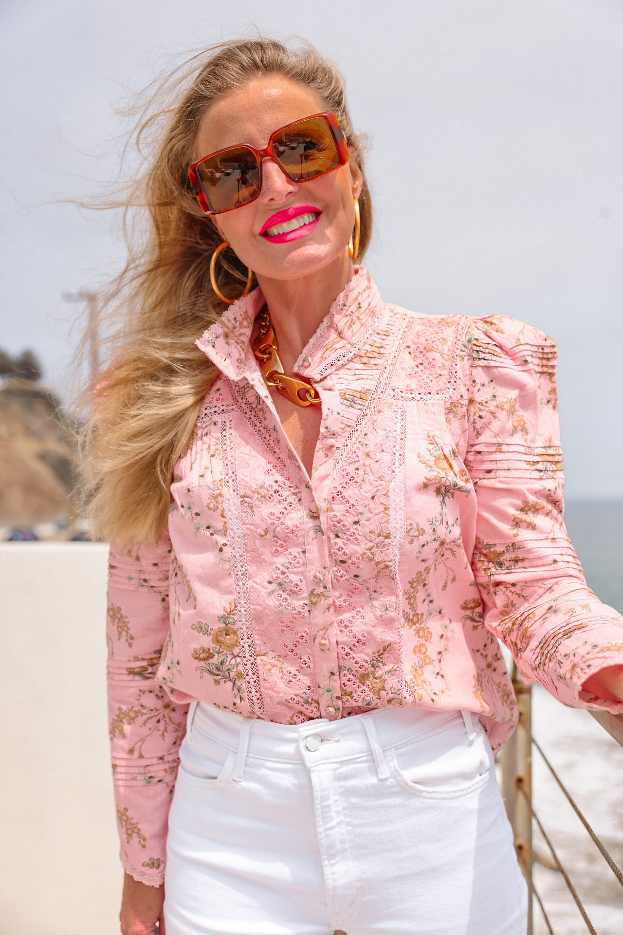 summer mom style, best summer mom outfits, summer mom outfits 2022, casual mom outfits summer, stylish mom outfits 2022, fashion for moms in their 30s, fashion for moms in their 40s, cute mom outfits, casual mom outfits, erin busbee, busbee style, fashion over 40, malibu, california, loveshackfancy pink printed top, white mother hustler jeans, see by chloe platform heels, saint laurent square sunglasses, paco rabbane chunky gold necklace, dean davidson hoops