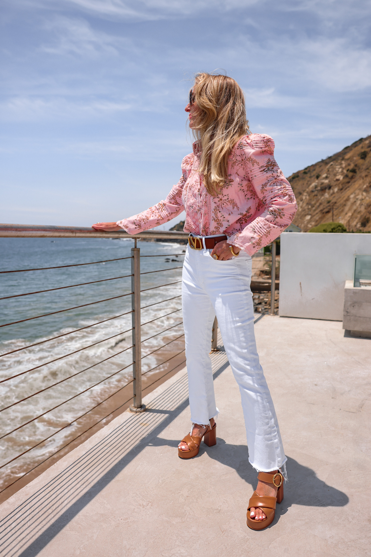 summer mom style, best summer mom outfits, summer mom outfits 2022, casual mom outfits summer, stylish mom outfits 2022, fashion for moms in their 30s, fashion for moms in their 40s, cute mom outfits, casual mom outfits, erin busbee, busbee style, fashion over 40, malibu, california, loveshackfancy pink printed top, white mother hustler jeans, see by chloe platform heels, saint laurent square sunglasses, paco rabbane chunky gold necklace, dean davidson hoops