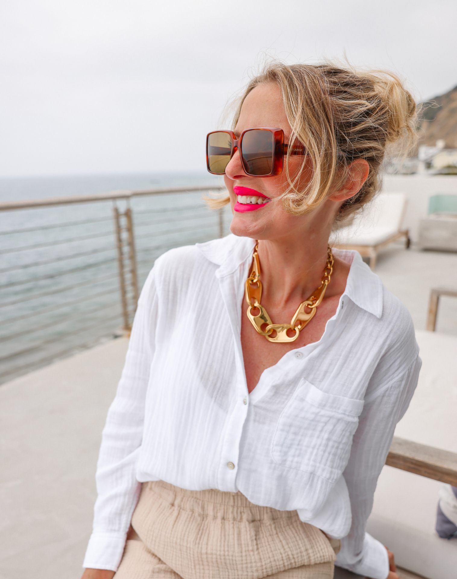 summer mom style, best summer mom outfits, summer mom outfits 2022, casual mom outfits summer, stylish mom outfits 2022, fashion for moms in their 30s, fashion for moms in their 40s, cute mom outfits, casual mom outfits, erin busbee, busbee style, fashion over 40, malibu, california, white rails cotton ellis button down shirt, rails leon gauzy pants, veronica beard woven wedges, saint laurent square sunglasses, paco rabbane chunky gold necklace, sustainability in fashion, sustainable fashion, sustainable fashion brands, why sustainability in fashion matters