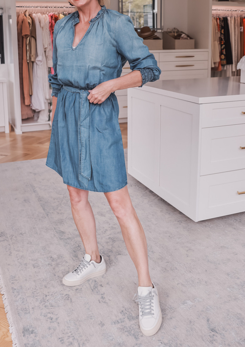 blue chambray dress with tie waist and white leather sneakers