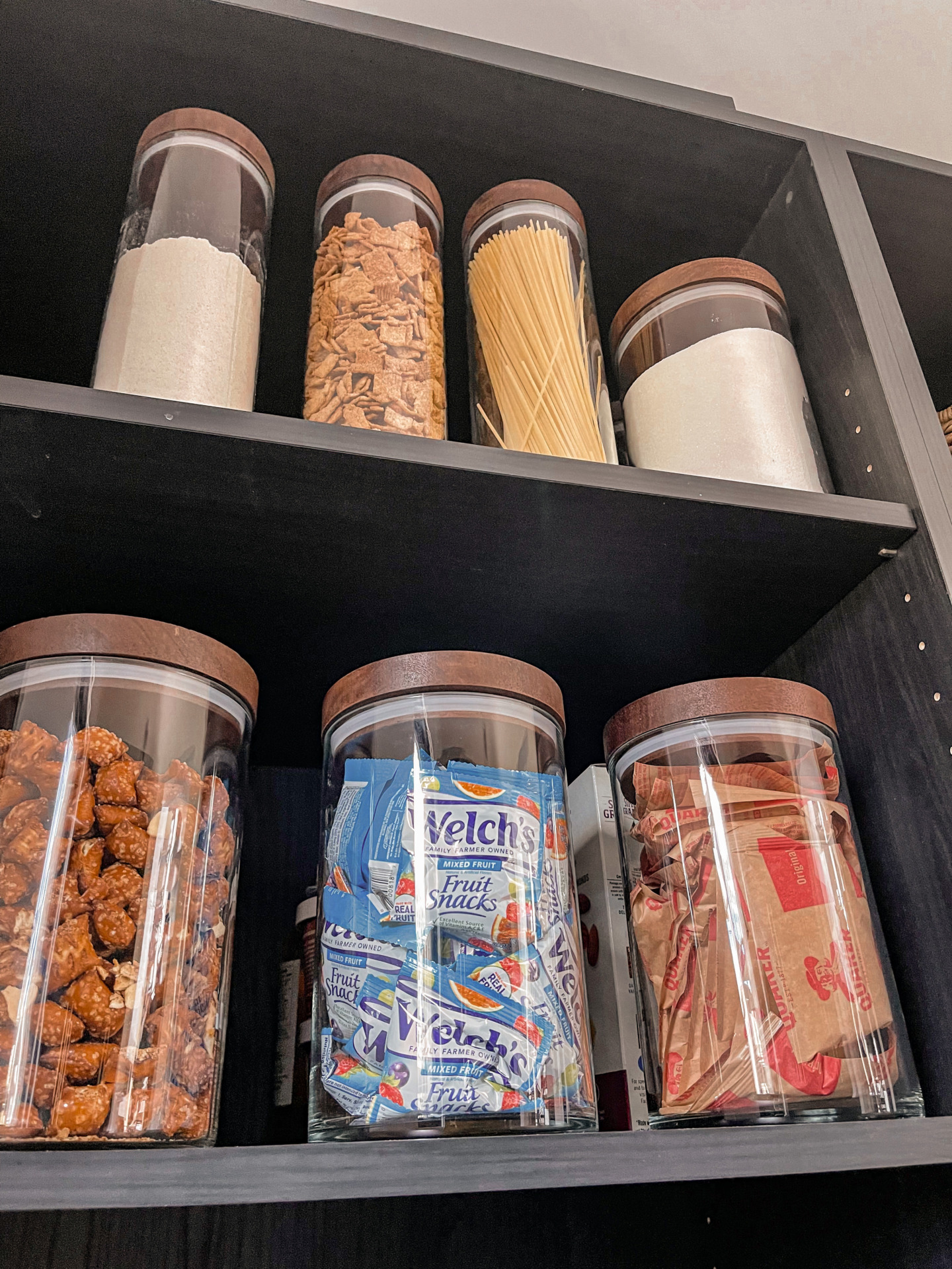 perfect pantry organization, clutter-free pantry, how to organize a pantry, keep your pantry organized, best baskets for pantry organization, clean pantry, rattan baskets, storage bins, labeled storage bins for pantry, erin Busbee, Busbee style, fashion over 40, telluride, CO
