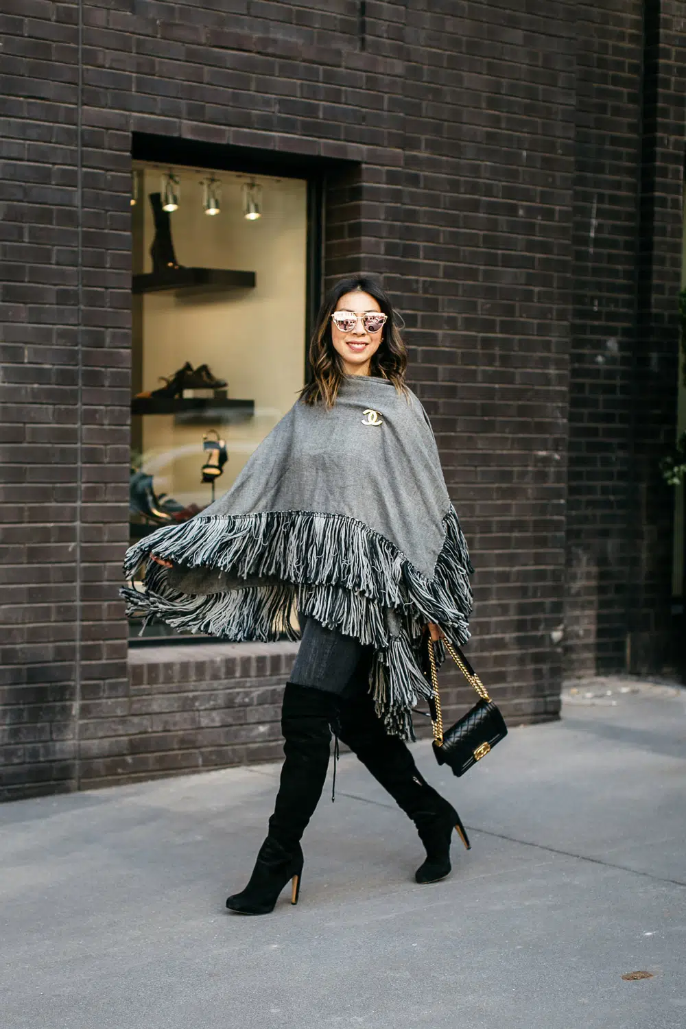 How to style a poncho, how to wear a poncho, wearing a poncho for fall, wearing a poncho in winter, what to wear under a poncho, modern poncho looks, how to put on a poncho, how to wear an asymmetrical poncho, sam stewart, style of sam, erin Busbee, fashion blogger over 40, Busbee style, telluride, Colorado