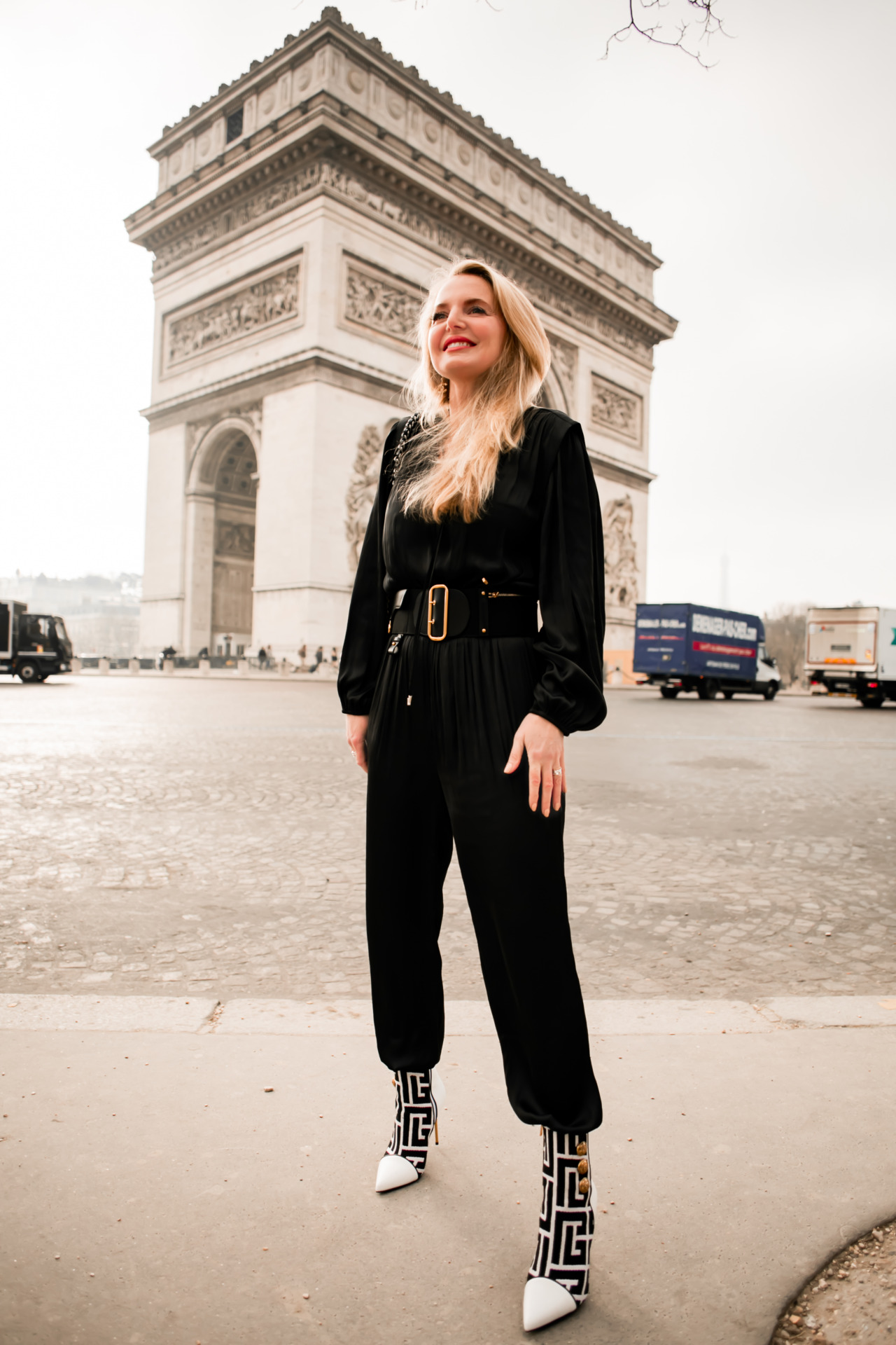 what to pack for paris, what to pack for paris fashion week, paris fashion week packing list, what I wore at paris fashion week, what I pack for a trip to paris, paris packing list, paris in febraury, erin busbee, busbee style, fashion over 40, paris, france, black maje jumpsuit, black and white balmain booties, dior belt, chanel flap bag, chanel earrings