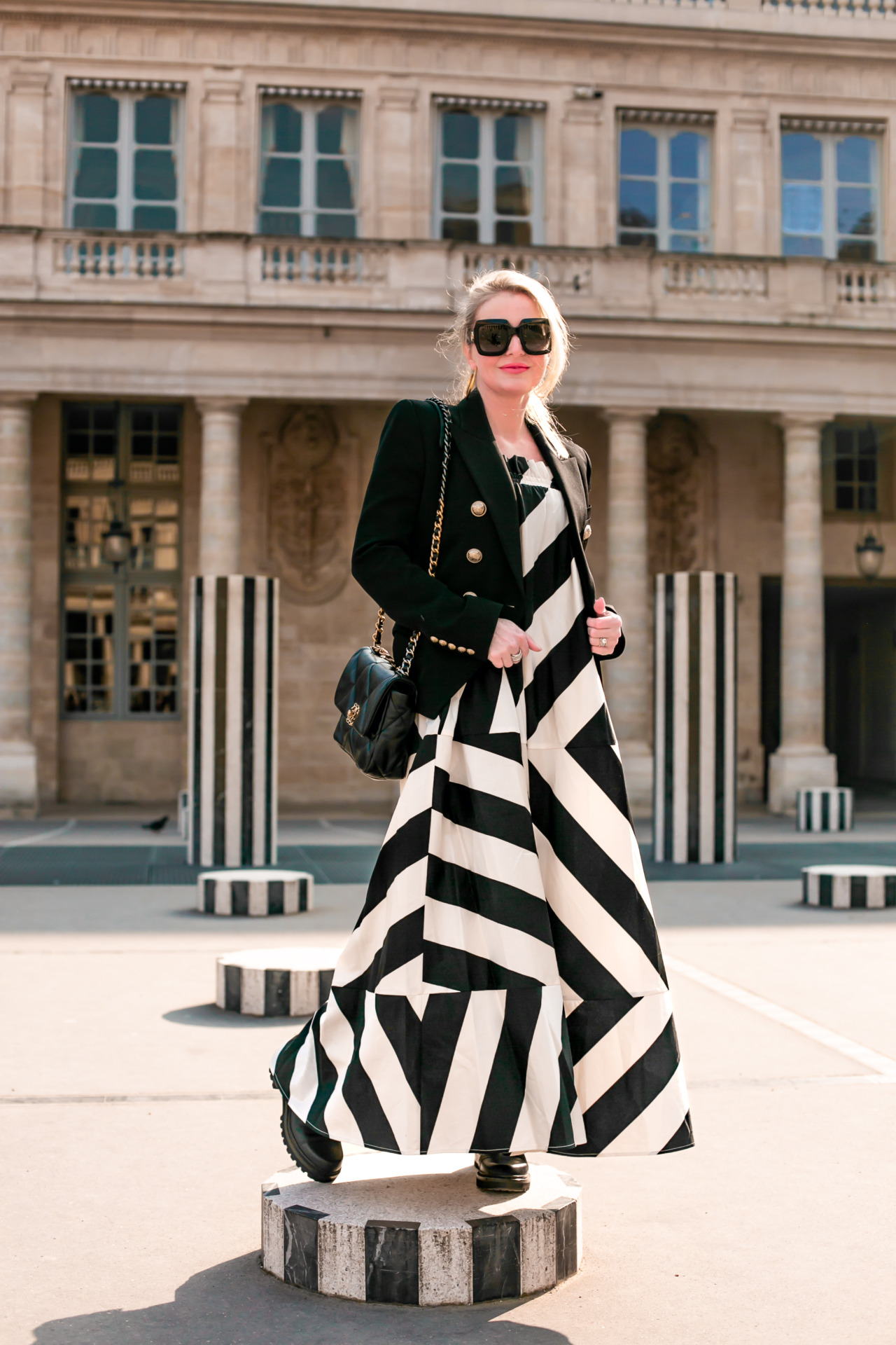what to pack for paris, what to pack for paris fashion week, paris fashion week packing list, what I wore at paris fashion week, what I pack for a trip to paris, paris packing list, paris in febraury, erin busbee, busbee style, fashion over 40, paris, france, white and black striped tory burch maxi dress, see by chloe combat boots, gucci sunlgasses, chanel flap bag, black balmain blazer