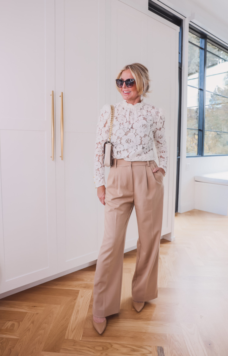 how to wear pleated pants, ways to wear pleated pants, ways to style pleated pants, how to style pleated pants, pleated trousers women, pleated pants over 40, favorite daughter pleated pants, pleated pants 2023, pleated pants outfits, erin busbee, busbee style, fashion over 40, wayf lace emma top, sam edelman beige hazel pumps, le spec sunglasses, marc jacobs tri-color handbag