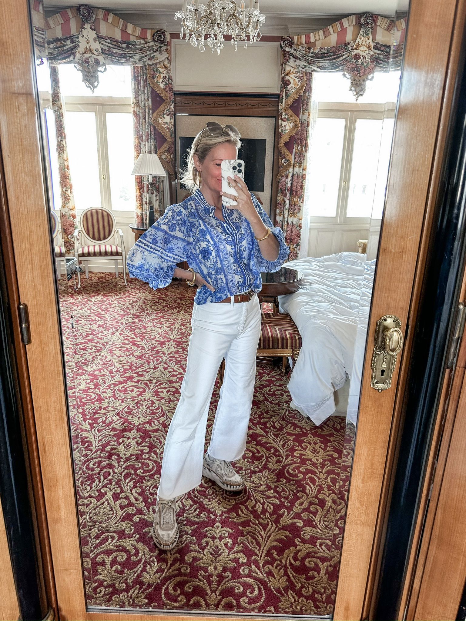 What to wear with white jeans, how to wear white jeans, best white jeans for women, white jeans that aren’t see-through, style white jeans, white jeans for summer, how to transition white jeans to fall, tips for wearing white jeans, Erin Busbee, Busbee Style, fashion over 40, Telluride, CO, alice + olivia blue printed blouse, chloe nama platform sneakers, pistola white jeans