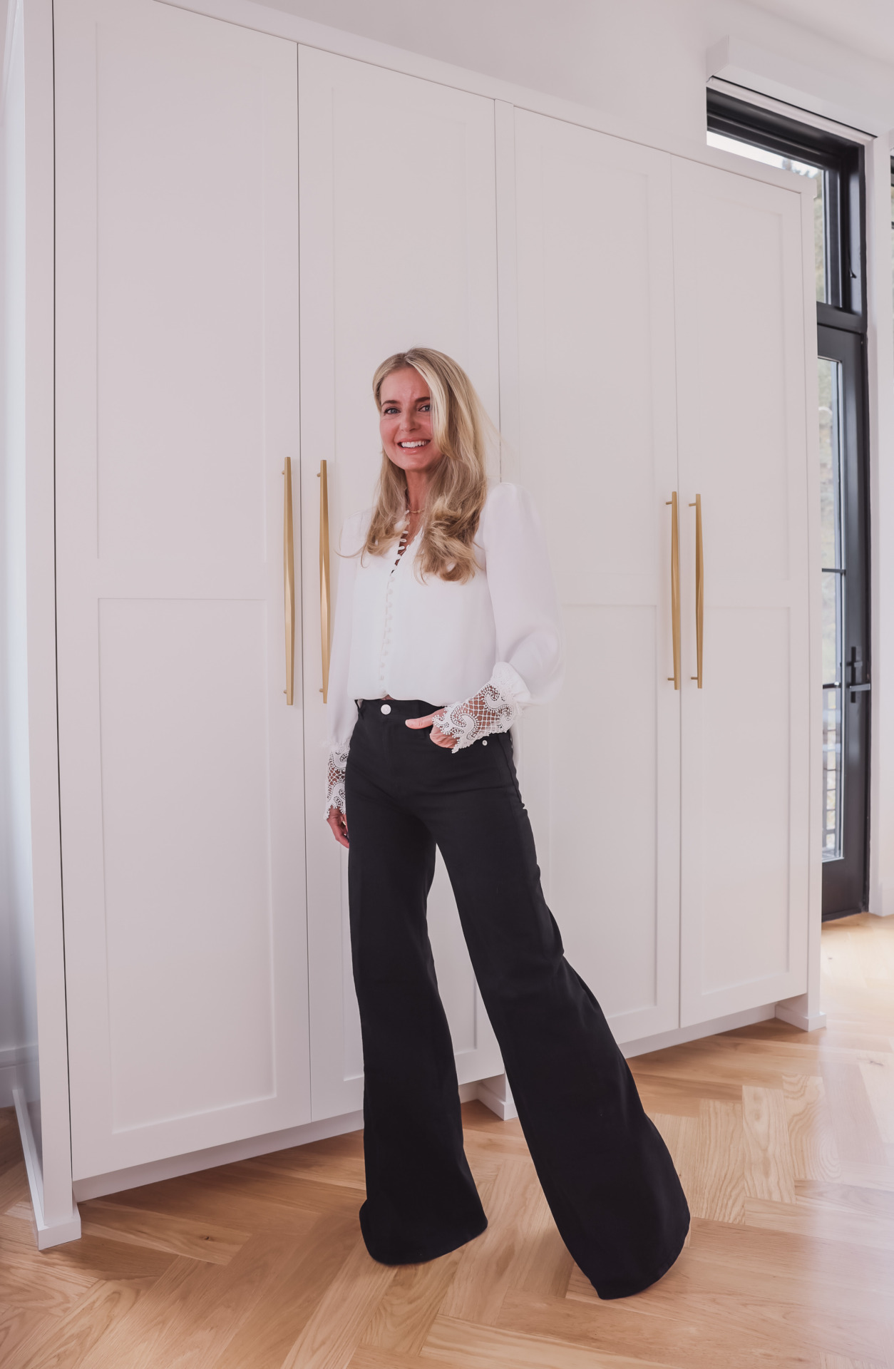 woman wearing Wide-Leg pants and white top for jean trends