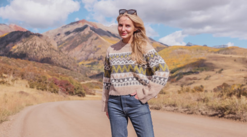 Erin Busbee by mountains in fall wearing velvet fairisle sweater