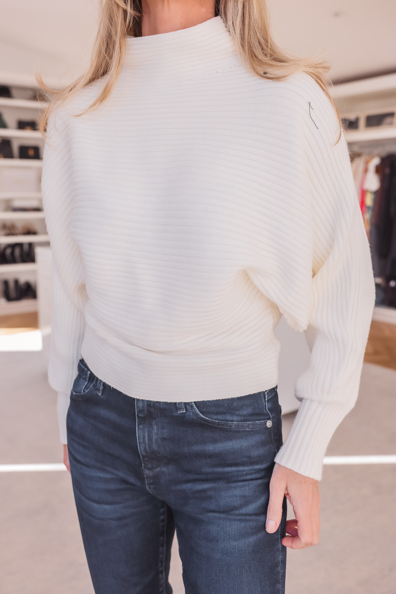 cream sweater and jeans