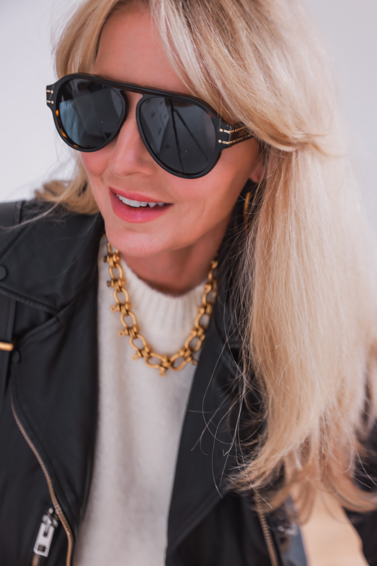 sunglasses and chunky chain necklace