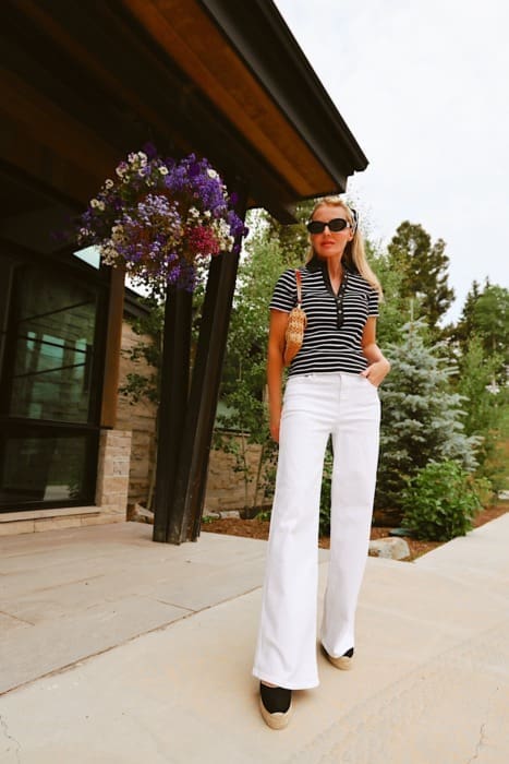 viral east coast summer style trend and how to wear it featuring striped polo shirt by Veronica Beard, white wide leg jeans by FRAME, prada triangle scarf in black and white and Staud beaded bag