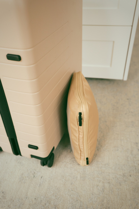 use compression cubes in half your suitcase to pack lighter in just a carry on suitcase